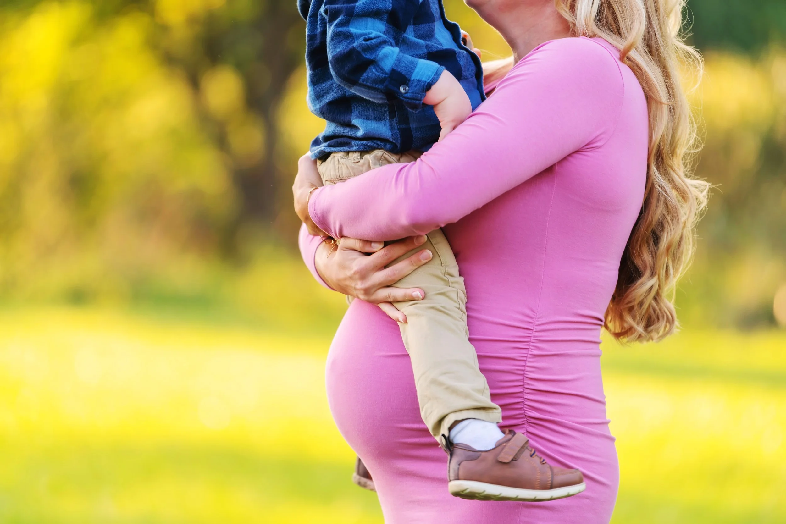 Mom to be with toddler for a maternity session 