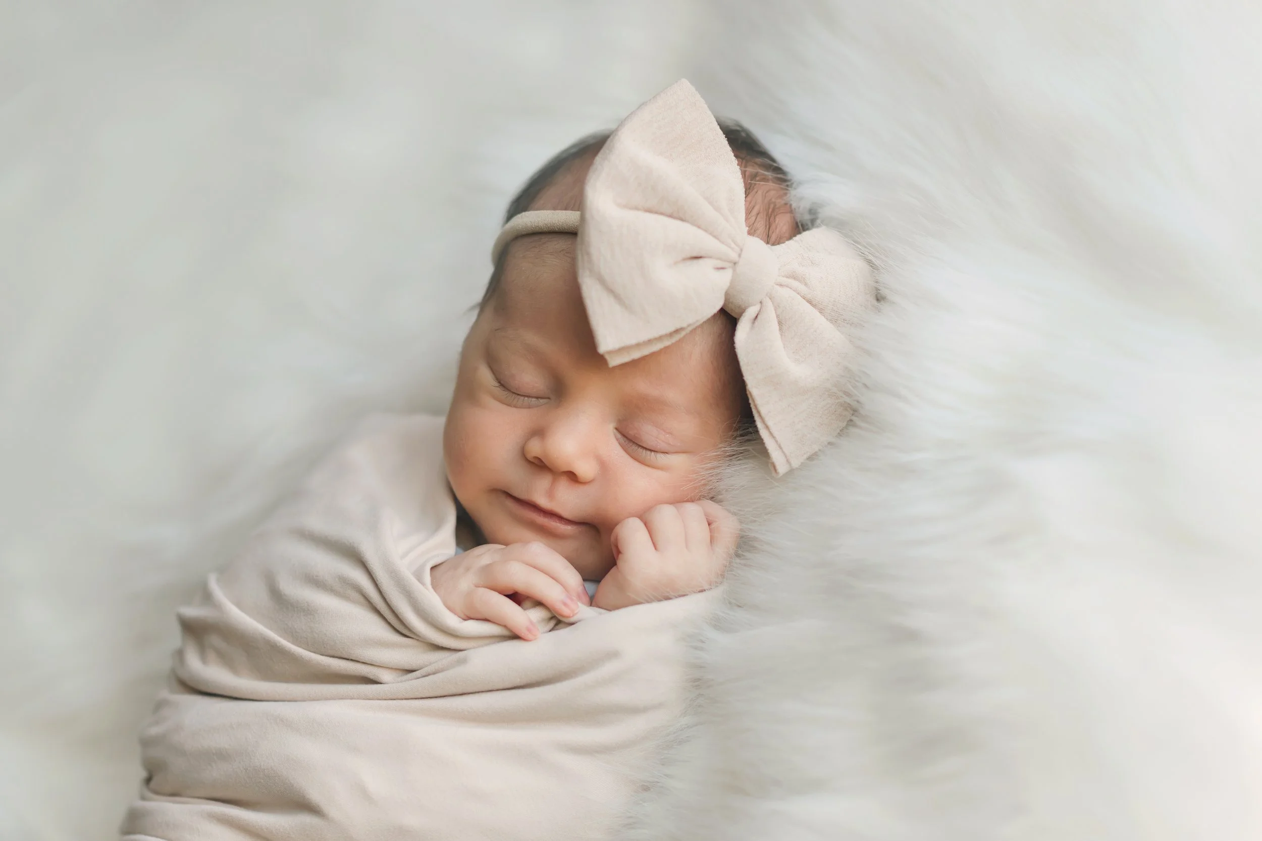 Newborn baby girl neutral newborn wraps and bow Chicago