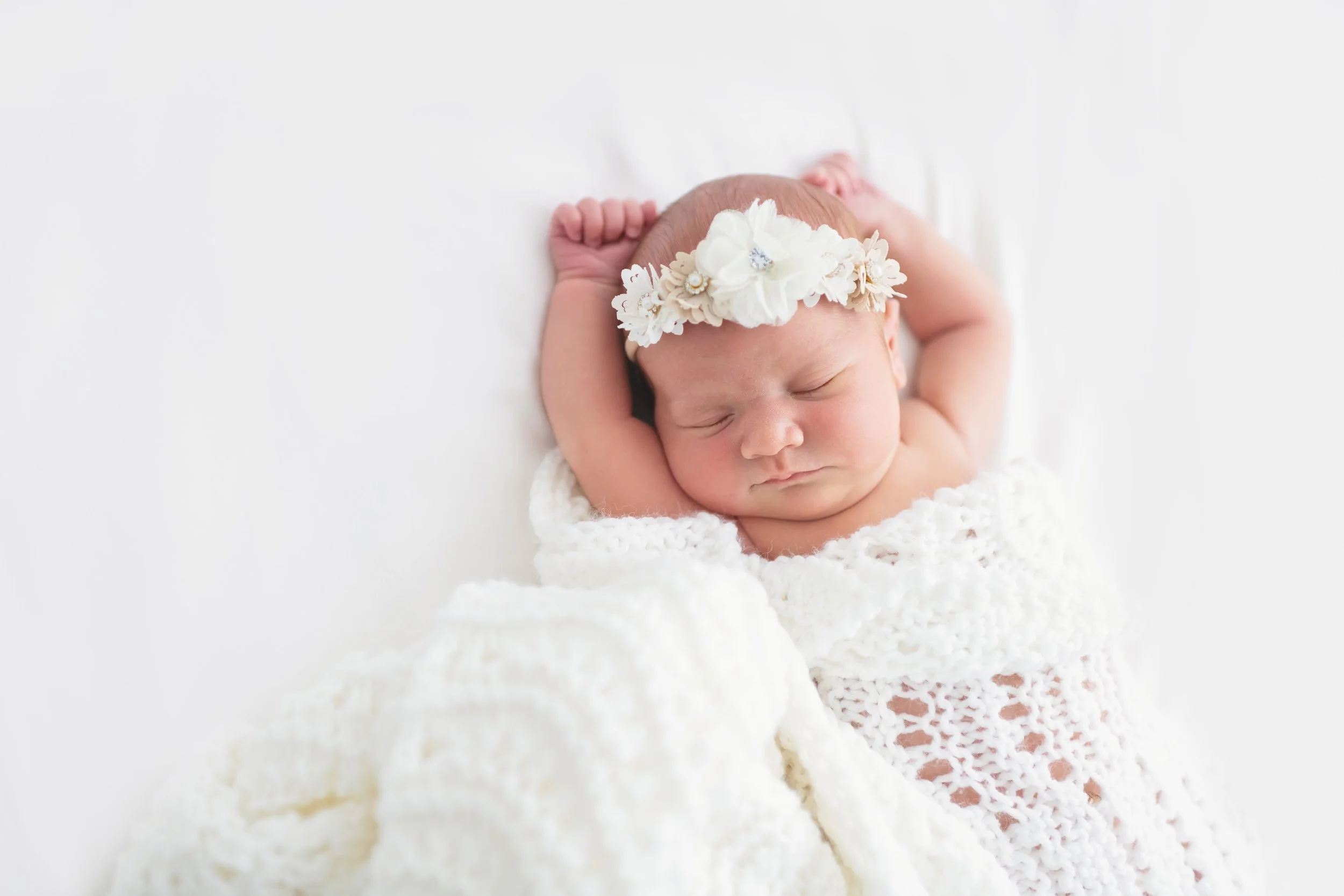 Stretching baby girl in a studio newborn session Tinley Park
