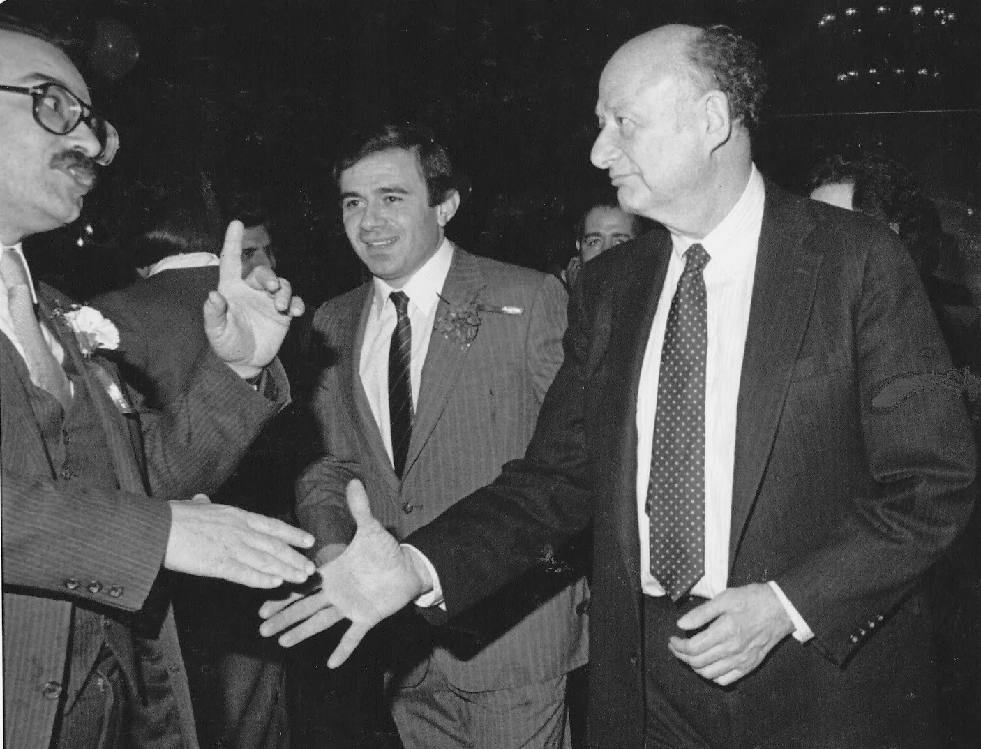 Mayor Edward I Koch, flanked by the former Councilman Sal Albanese, encounters a constituent intent on expressing his opinion at a Brooklyn town hall meeting in 1984. By Todd Maisel