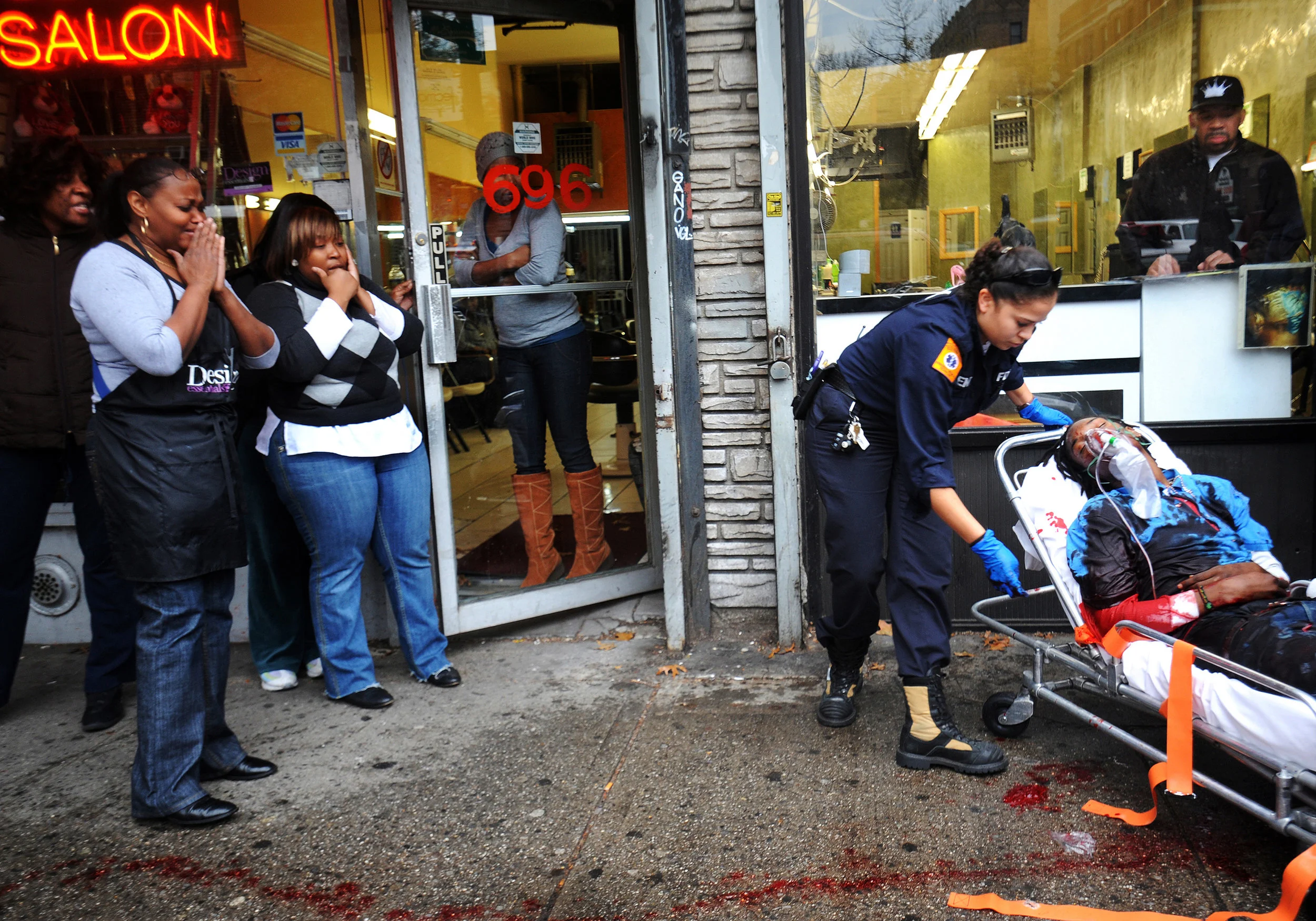  Spot news winner 2009. A young man was stabbed and seriously wounded this afternoon in front of the Parkside Deli and Grocery at 184 Parkside Avenue across from Prospect Park in Flatbush, Brooklyn. The unidentified victim ran from his attackers with