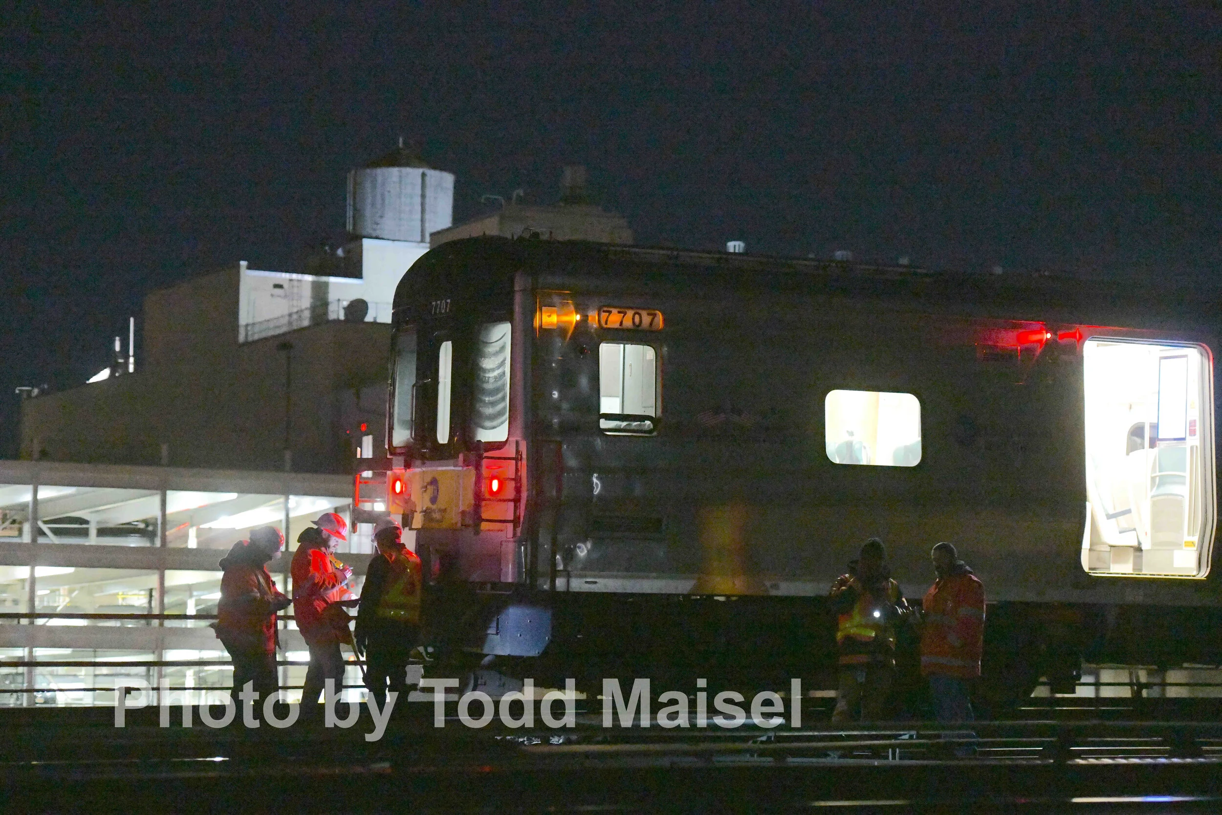  Long Island Railroad workers try to figure out why their train heading into the Jamaica Avenue station derailed a quarter mile before the station Nov. 23, 2019 