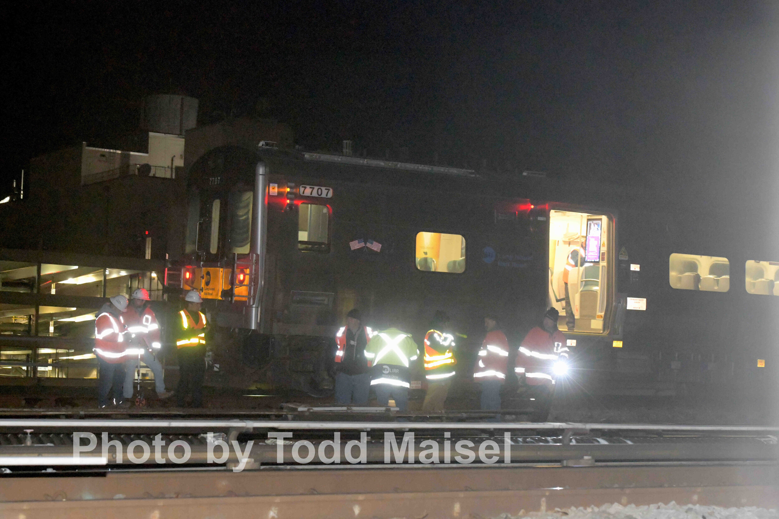  Long Island Railroad workers try to figure out why their train heading into the Jamaica Avenue station derailed a quarter mile before the station Nov. 23, 2019 