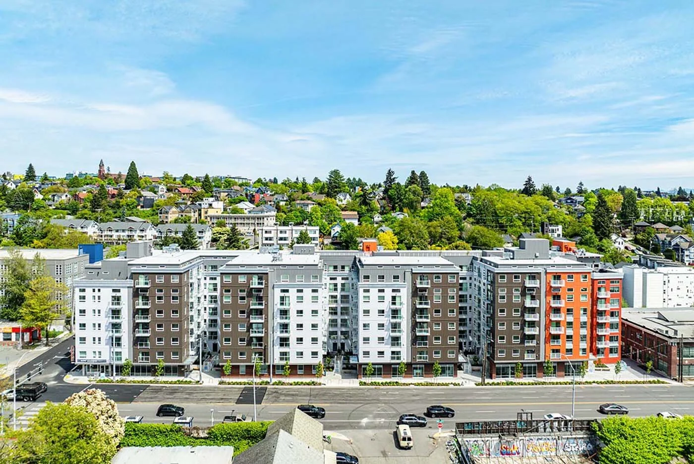Ribbon snipped on 900 Rainier with 396 units and education center