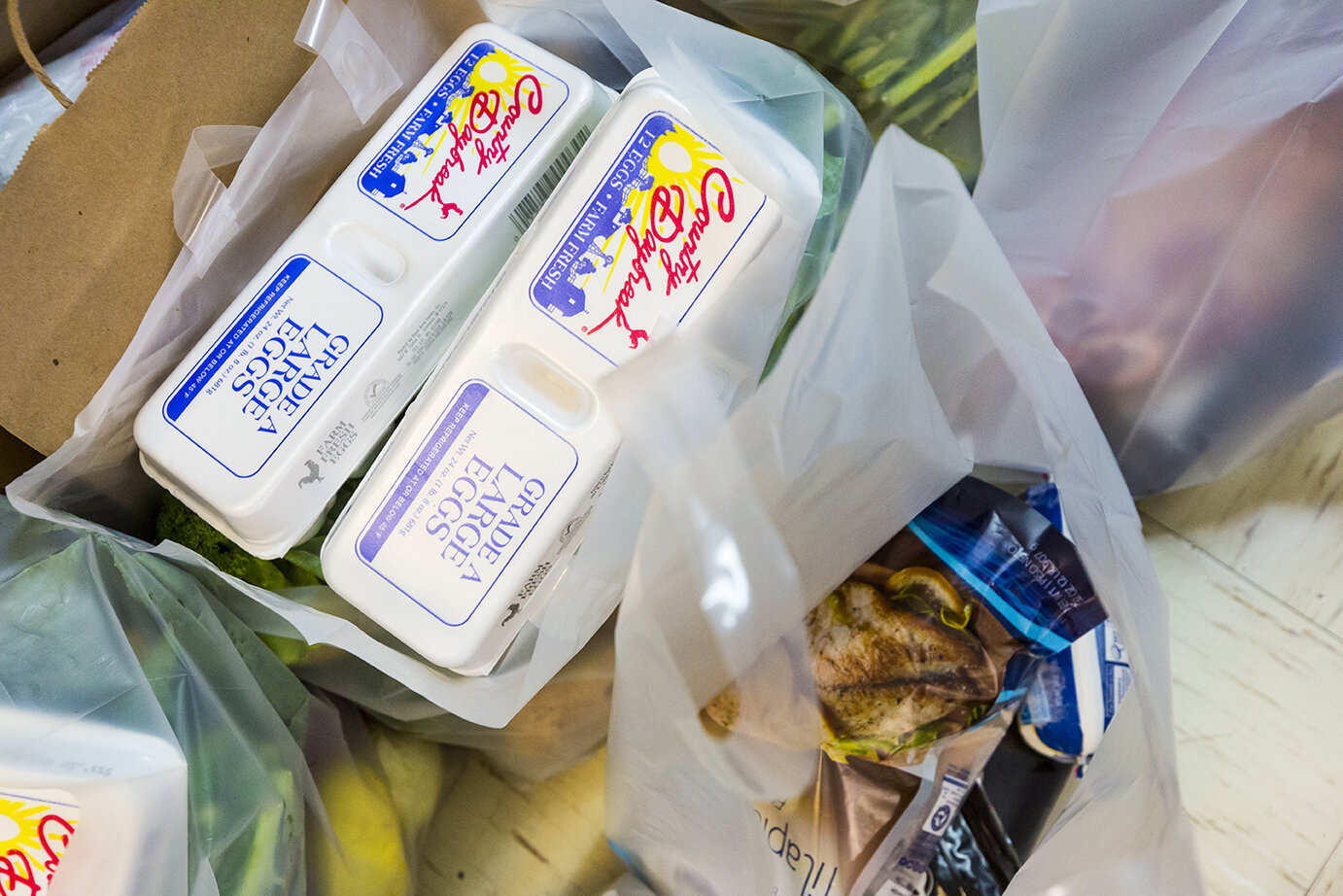 Bags of food in the storage units of Friends for Life's food pantry