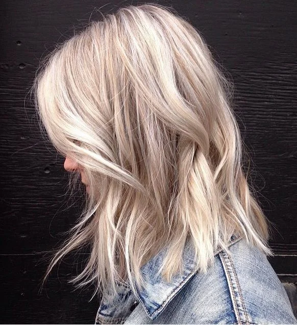 Dimensional dusty blonde hair.