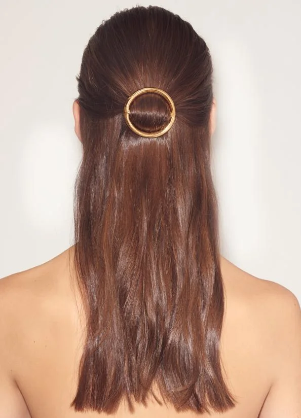 Subtle yet elegant gold barrette.