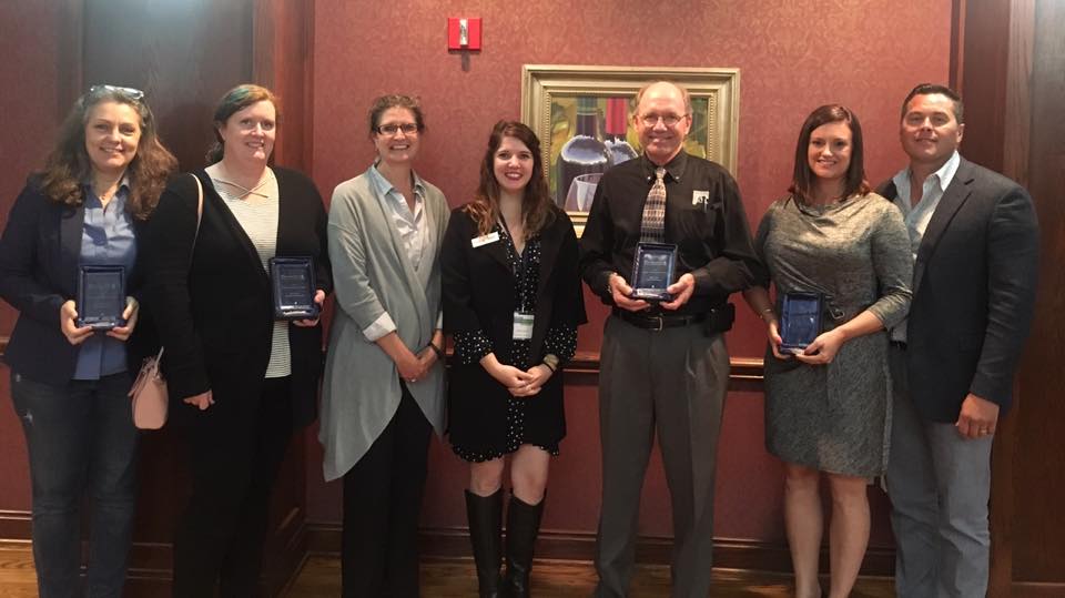 From left - Terri Sadler, Okie Mod Squad co-founder, accepting award for Lynne Rostochil, Amanda Regnier and Kary Stackelback, Oklahoma Archeological Survey, POK Executive Director, Cayla Lewis, Rick Lueb, TAP Architecture, Jackie and Chad Potter, Fire Station #13