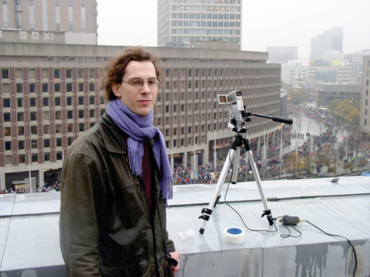 NECSI Researcher Richard Metzler captures the crowds from atop City Hall