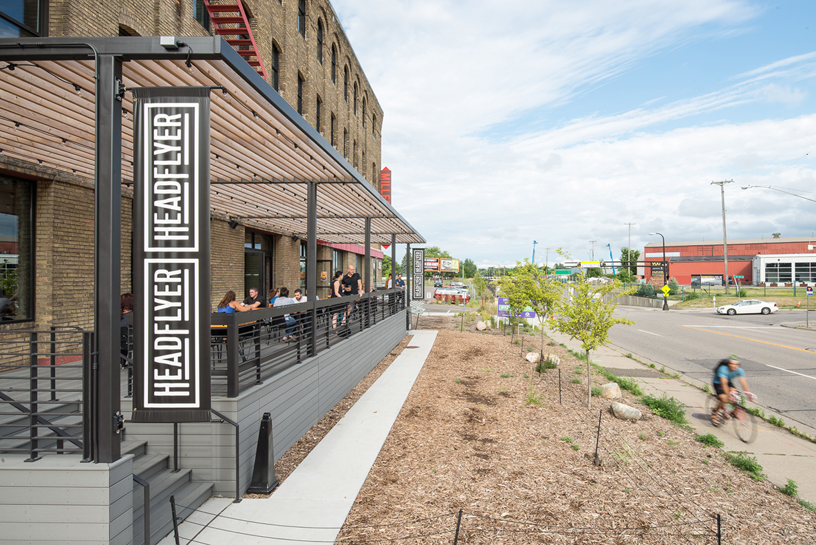 Cali Bamboo patio with custom steel and wood pergola at brewery in Minneapolis.