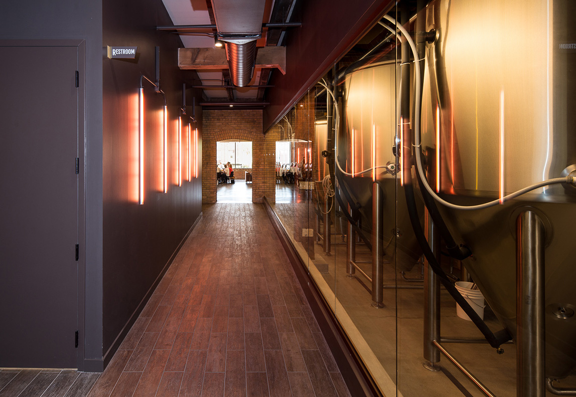 Custom neon lights in remodeled brewery space of Headflyer Brewing by Christian Dean Architecture.