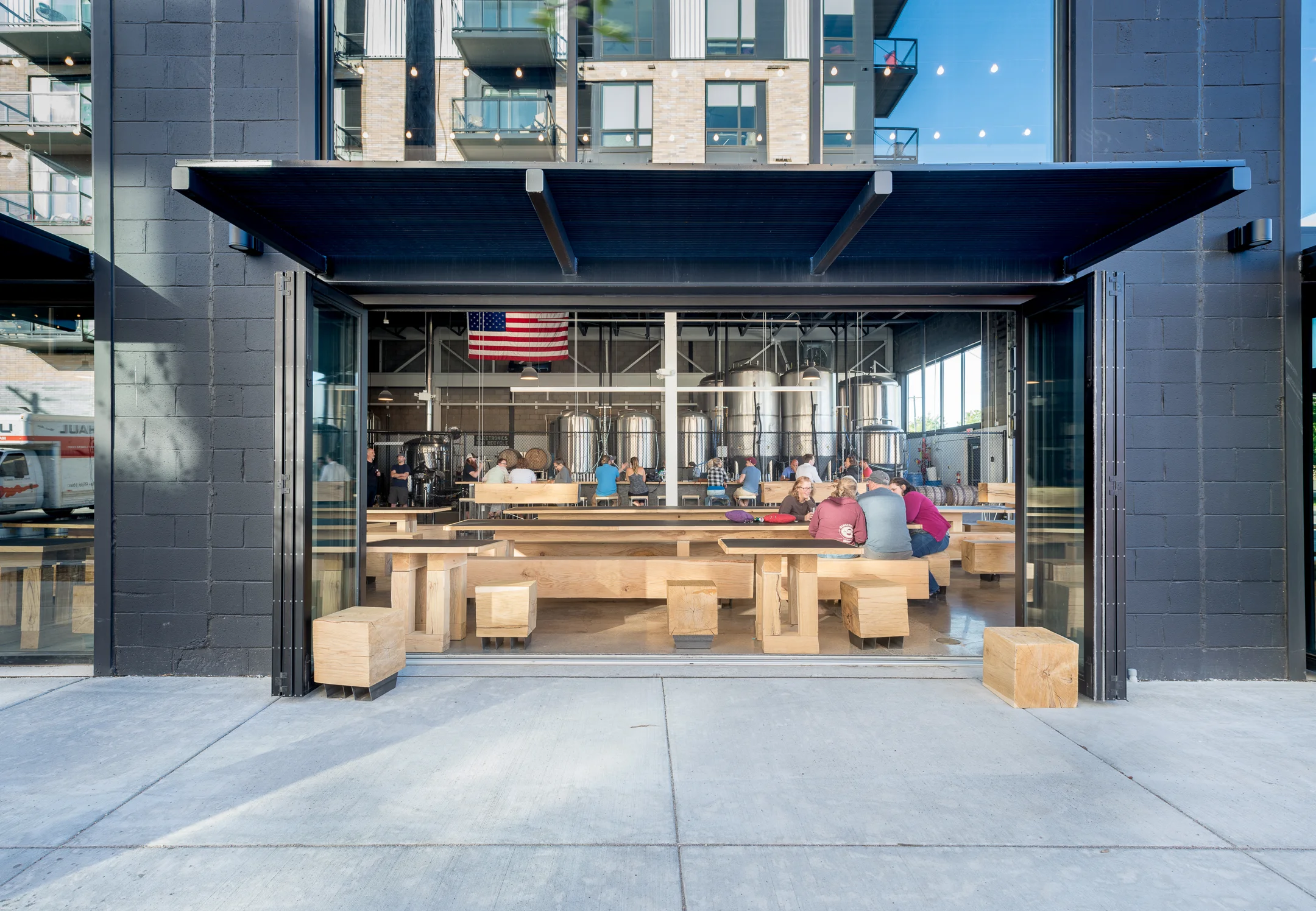 Open air seating area in brewery remodel by Christian Dean Architecture.