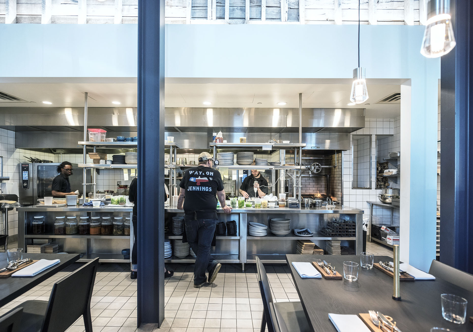open kitchen design with dining tables at upton 43 restaurant in minneapolis