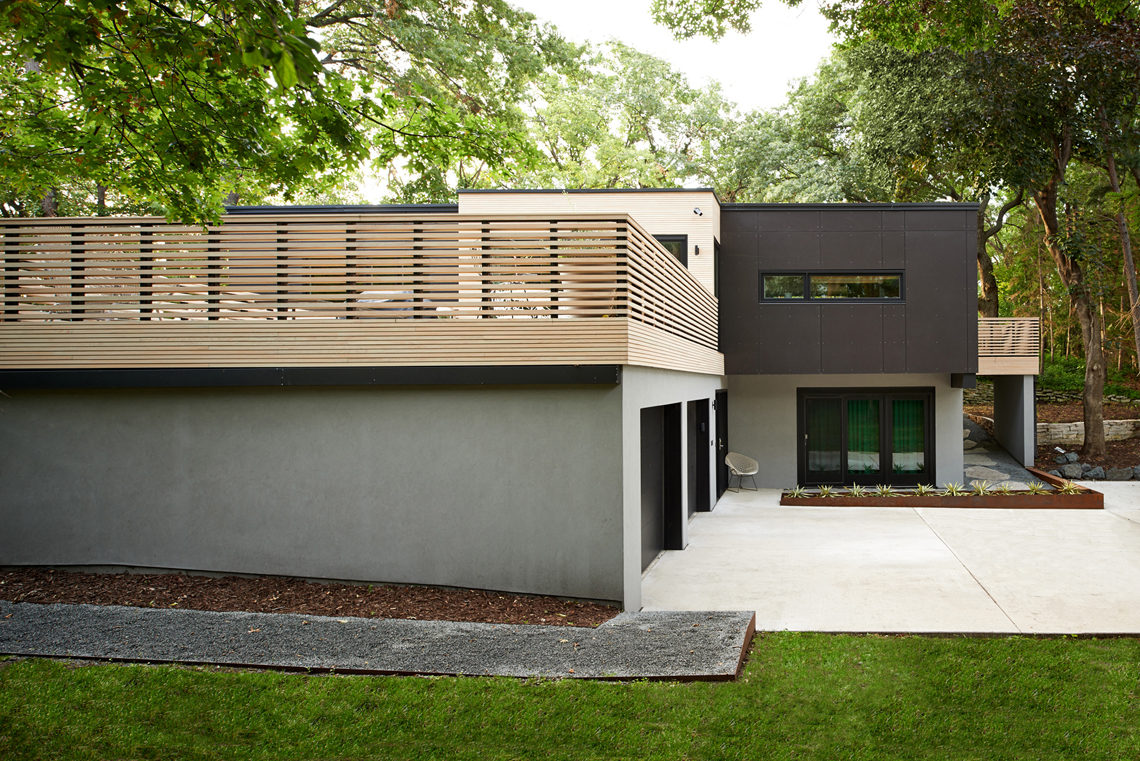 Roof deck with custom wood railing on modern home