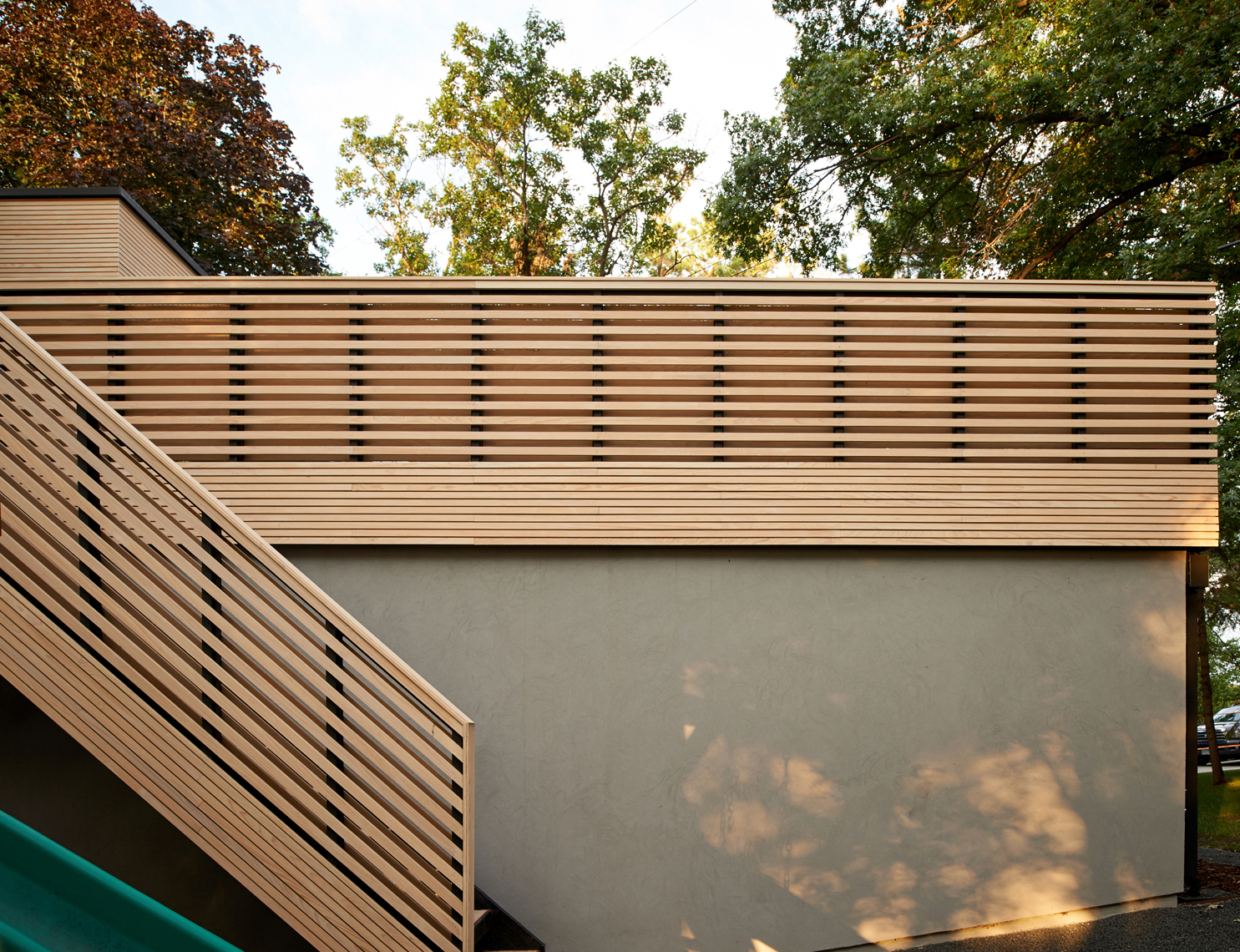 Custom wooden stair and railing on roof deck