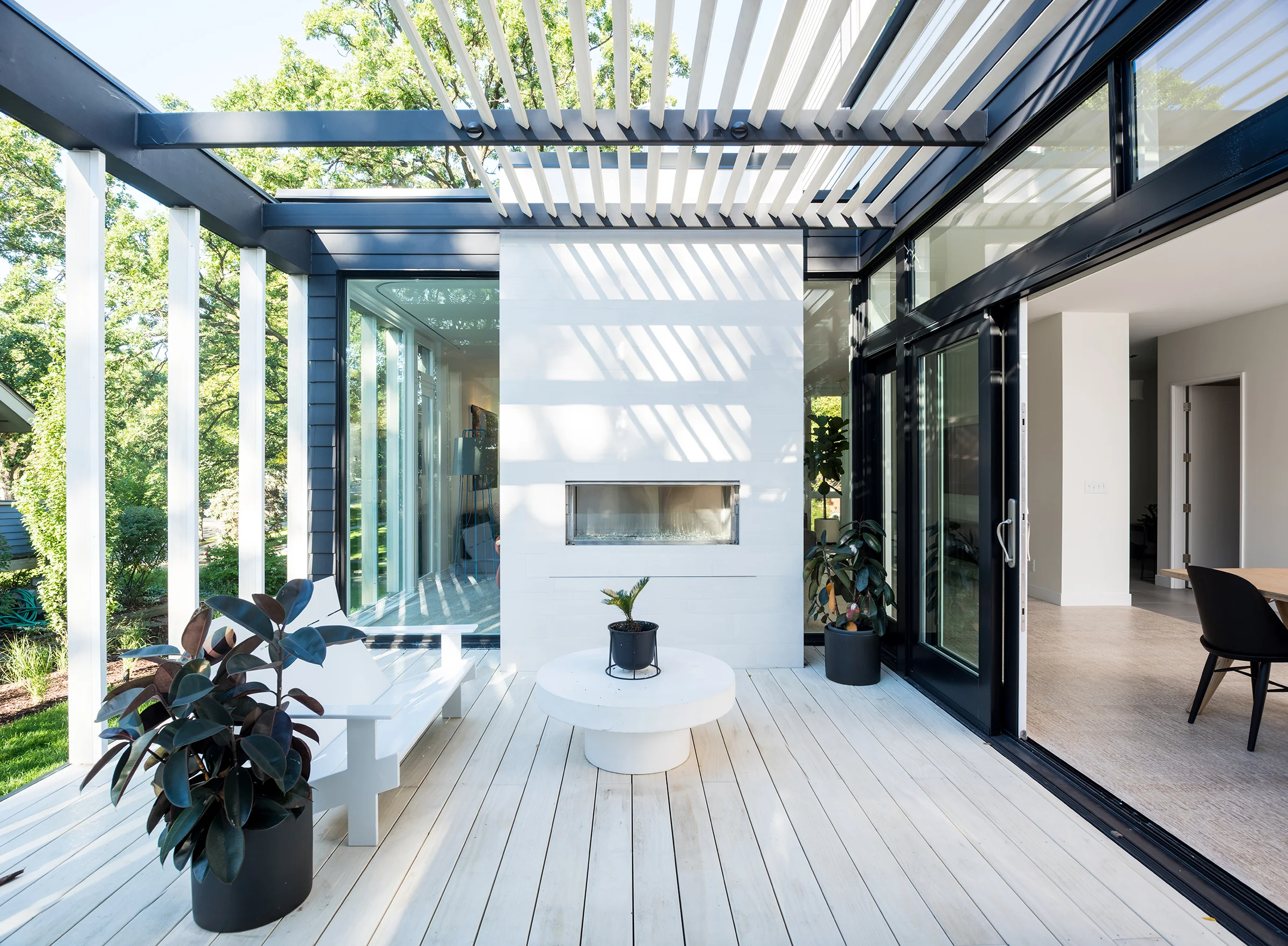Accoya wood deck with trellis and fireplace