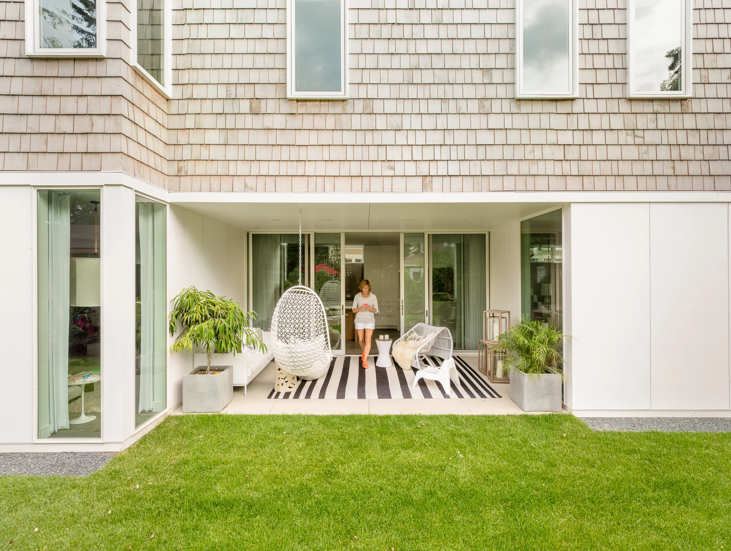 Covered outdoor patio on a modern beach home in Minneapolis