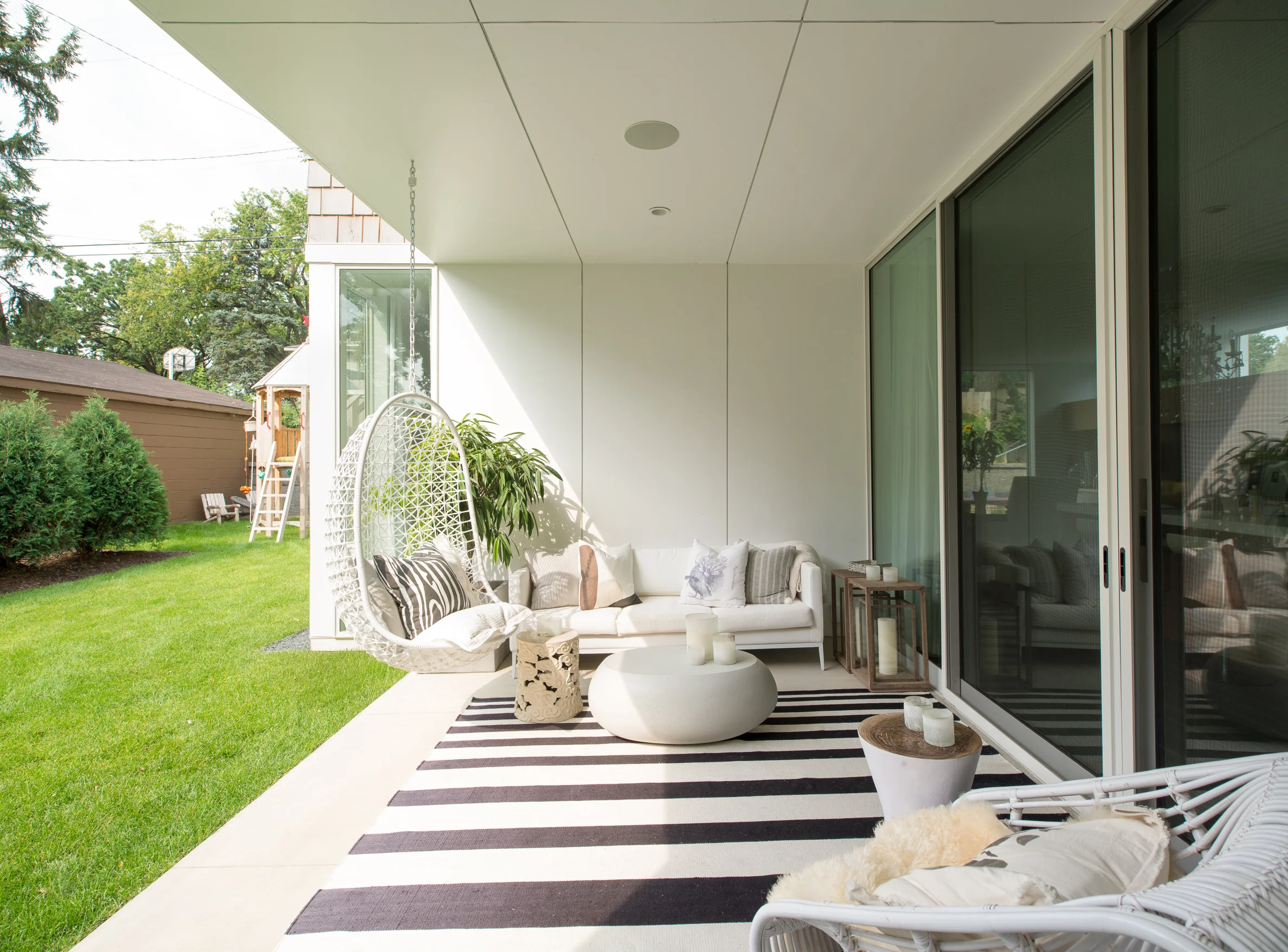 Covered outdoor patio on a modern beach home in Minneapolis