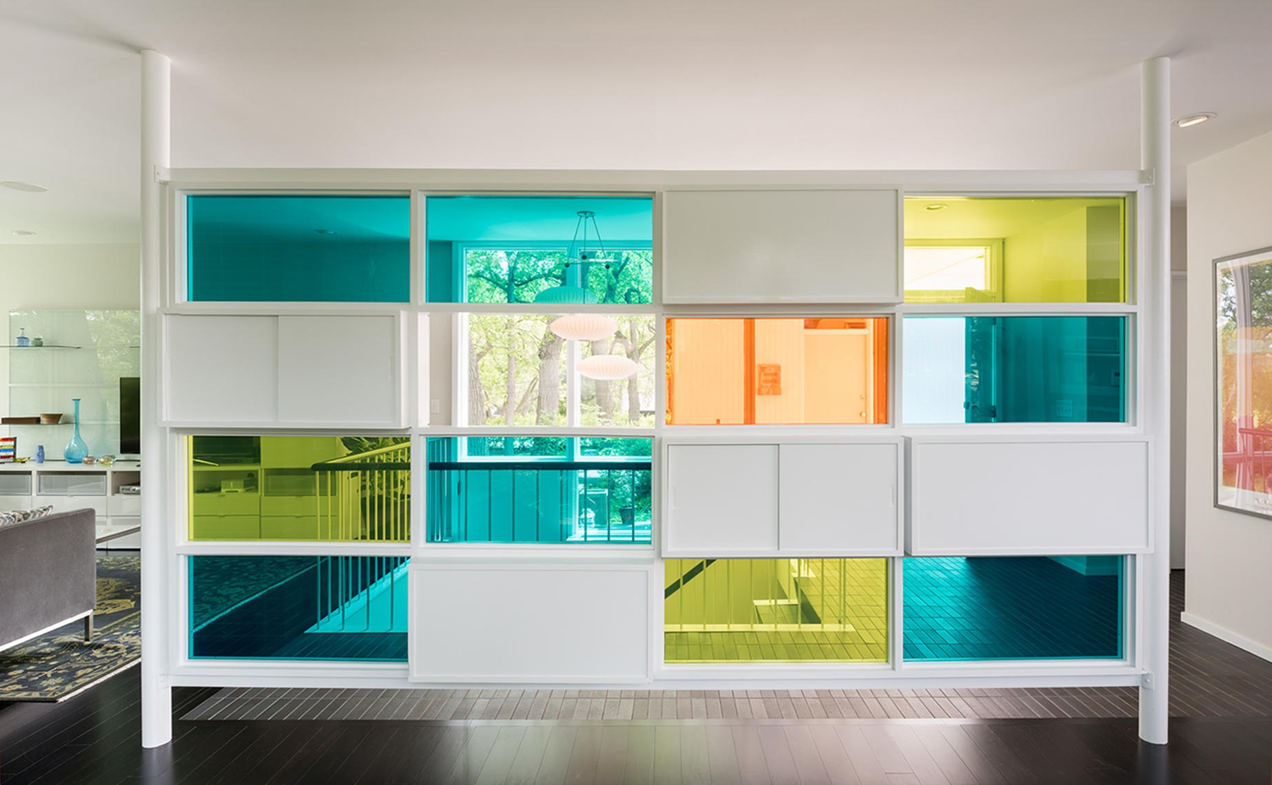 Colorful divider wall in a mid-century home entry