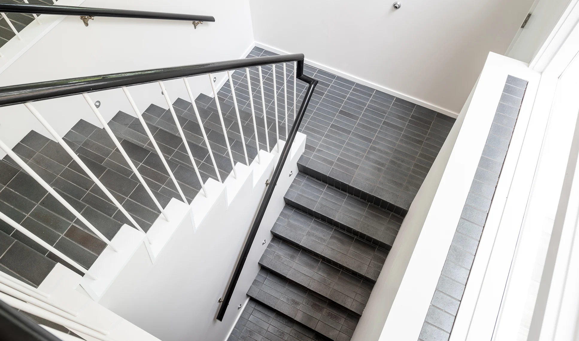Tiled open stairwell designed by Christian Dean Architecture