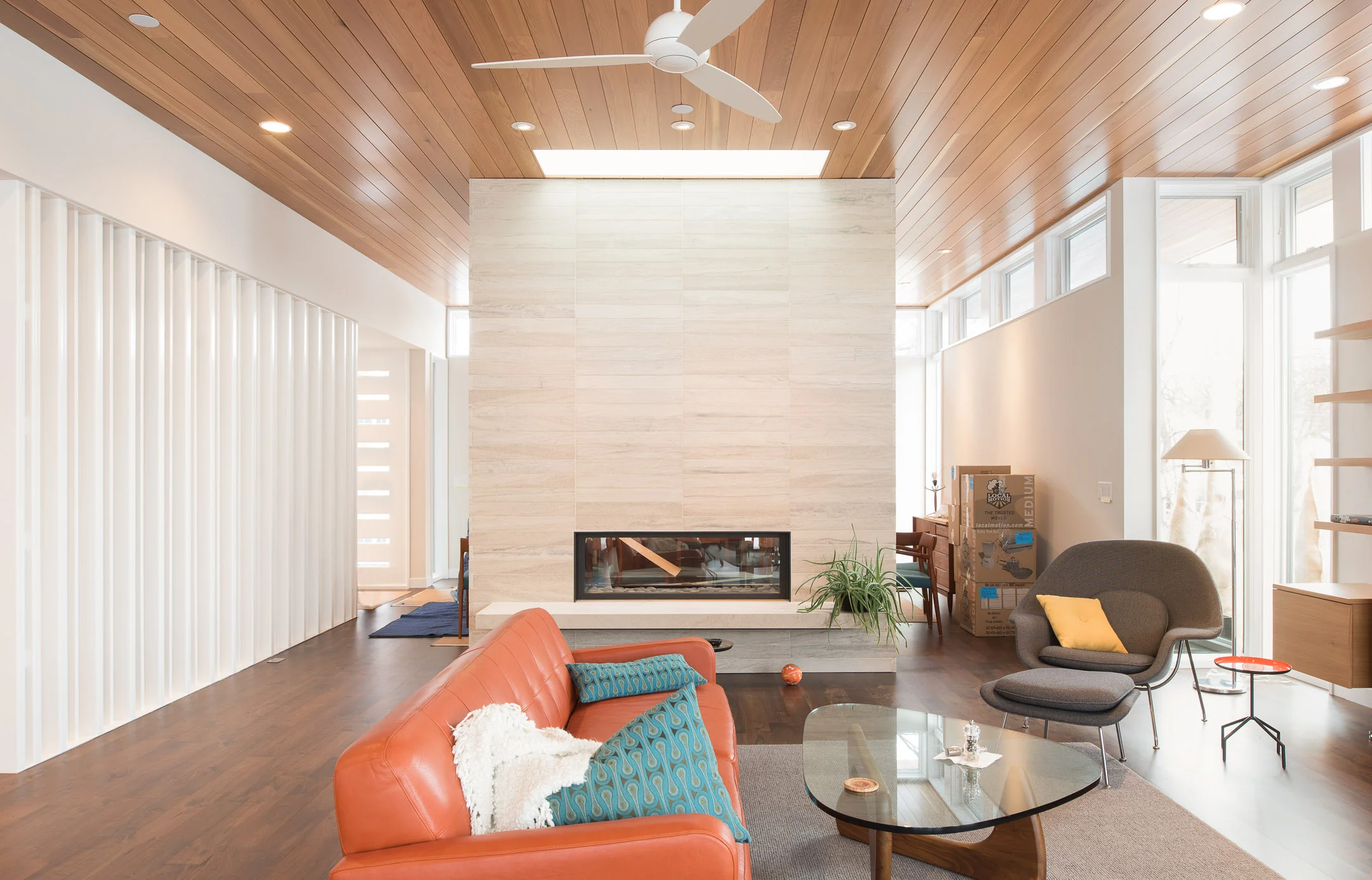 Modern living room with large dividing fireplace