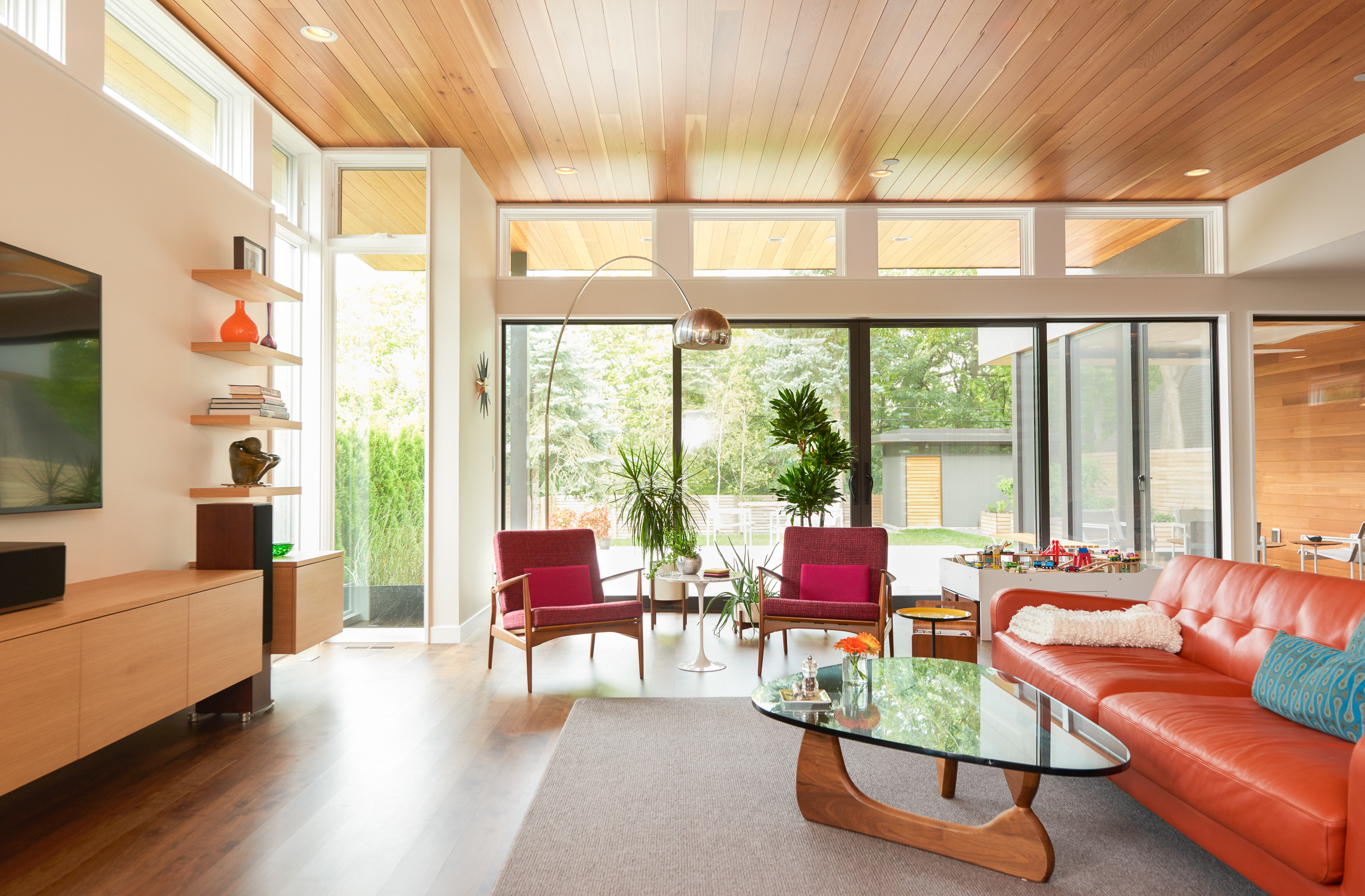 Modern living room open to backyard