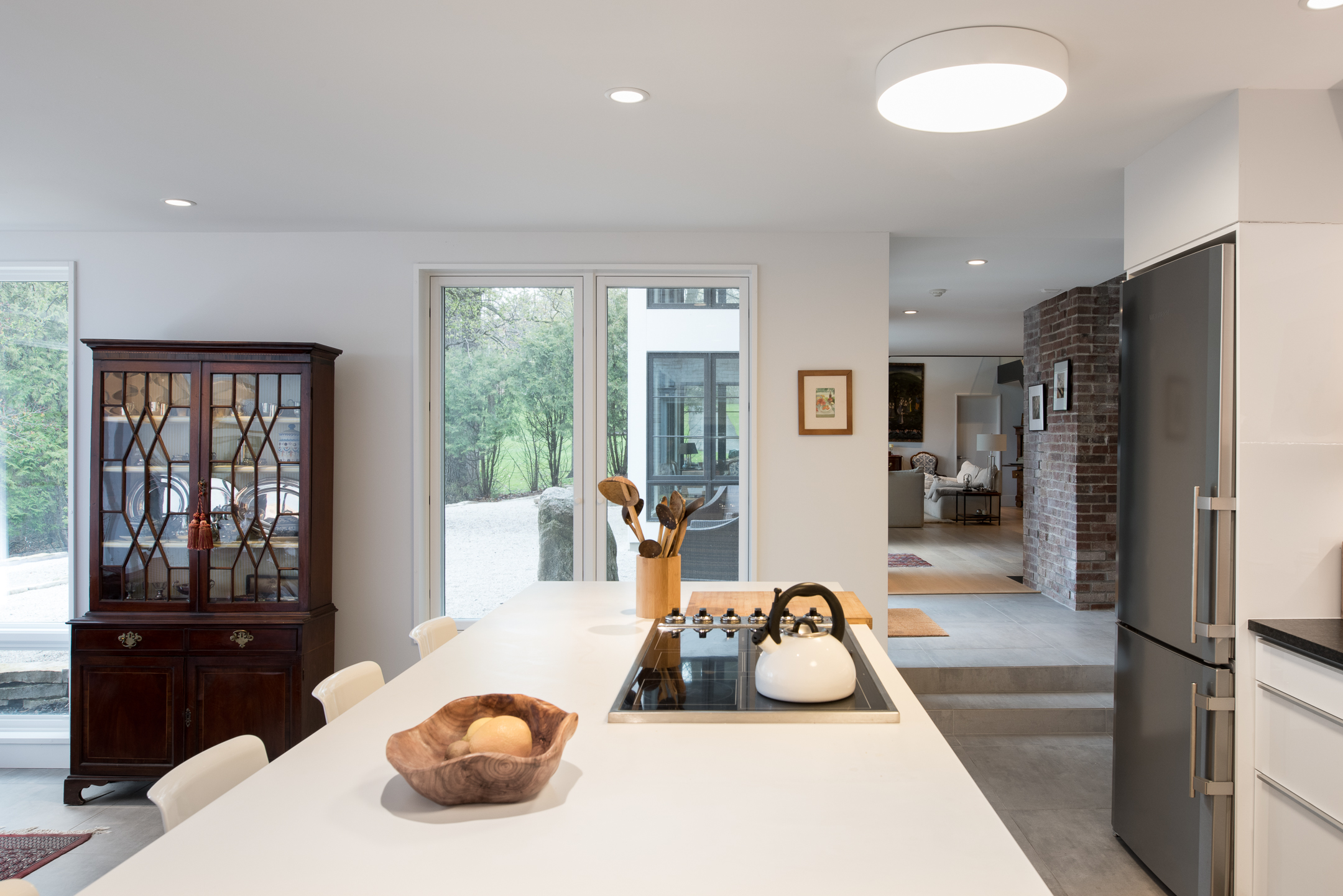 Modern monochrome kitchen with wood accents