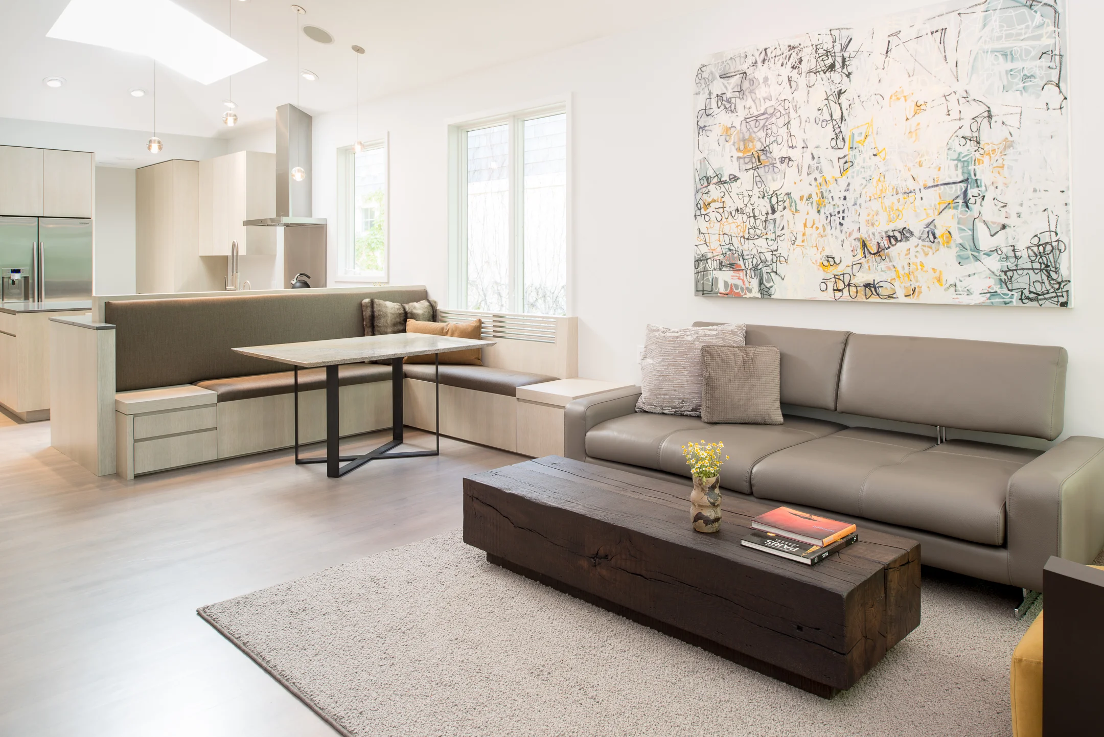 Modern living room open to kitchen and dining space
