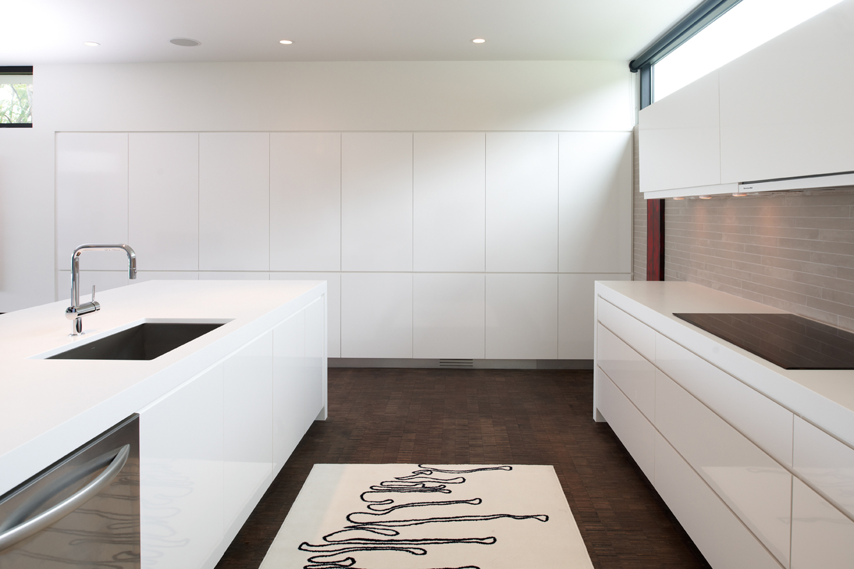 Minimal white kitchen with clerestory windows