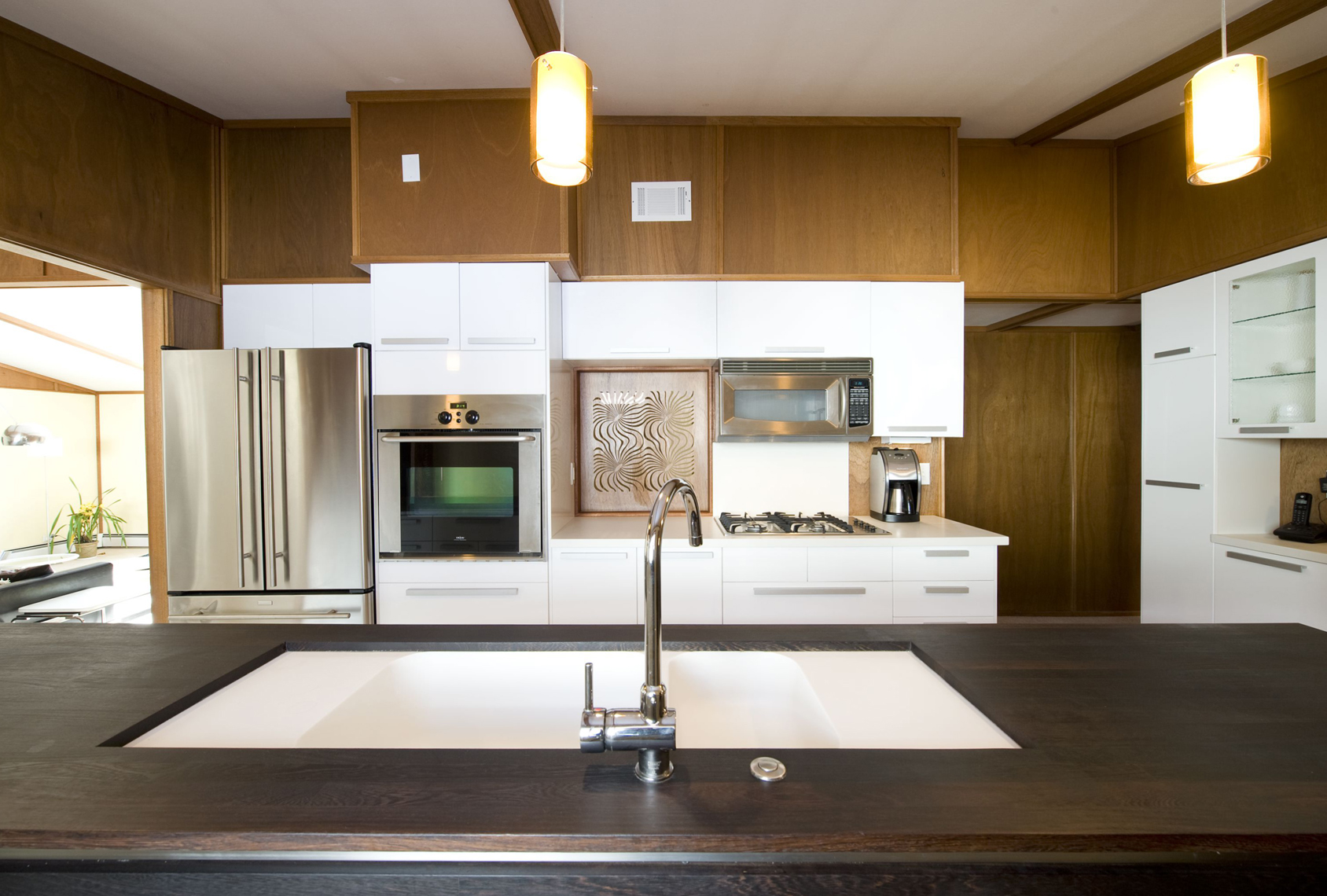Modern white kitchen infill renovation
