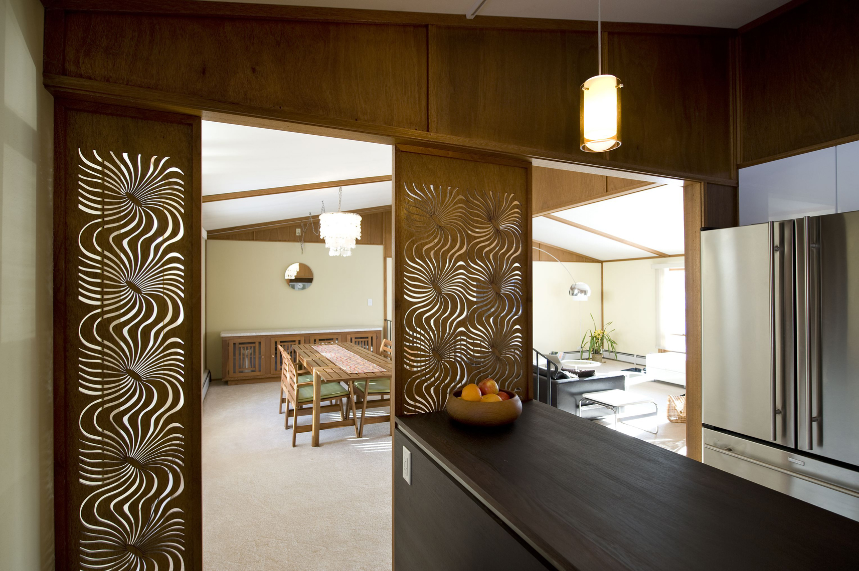 Graphic wood panel dividers into living area