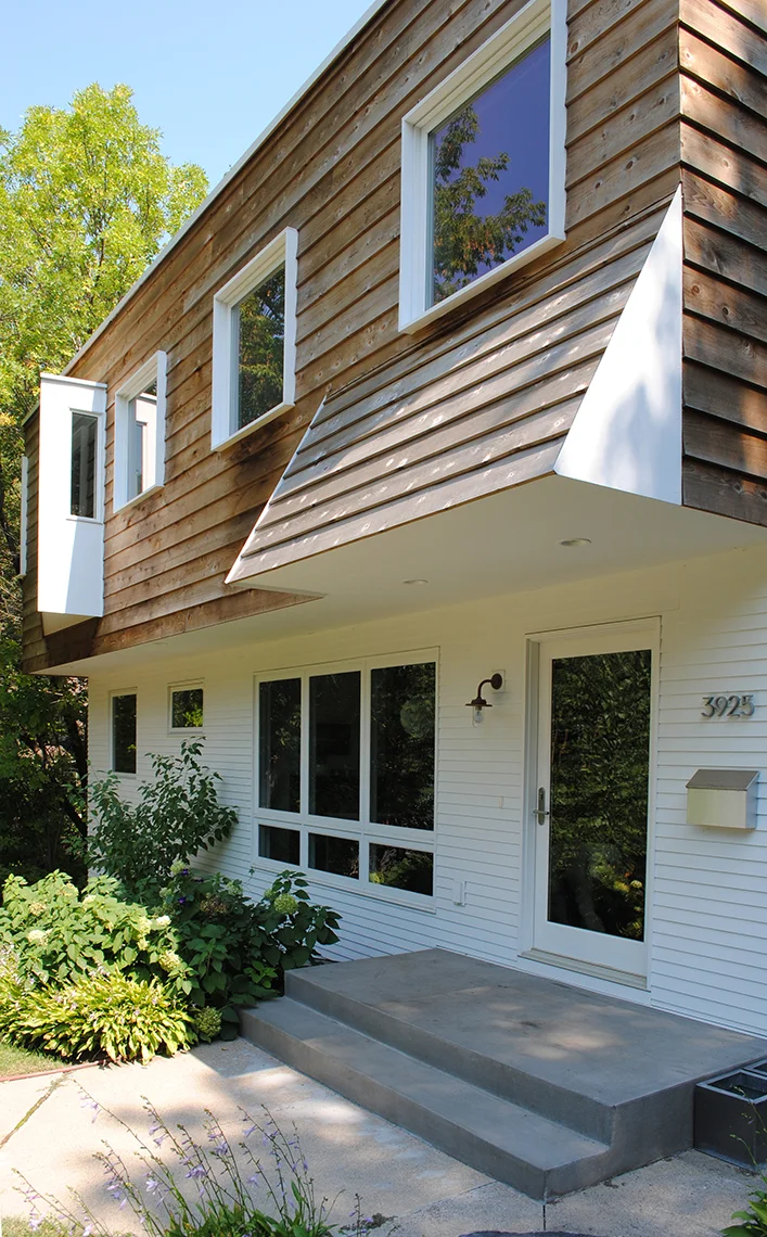 Geometric entry canopy over front porch