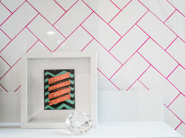 modern kitchen remodel with white herringbone tile layout and pink grout backsplash