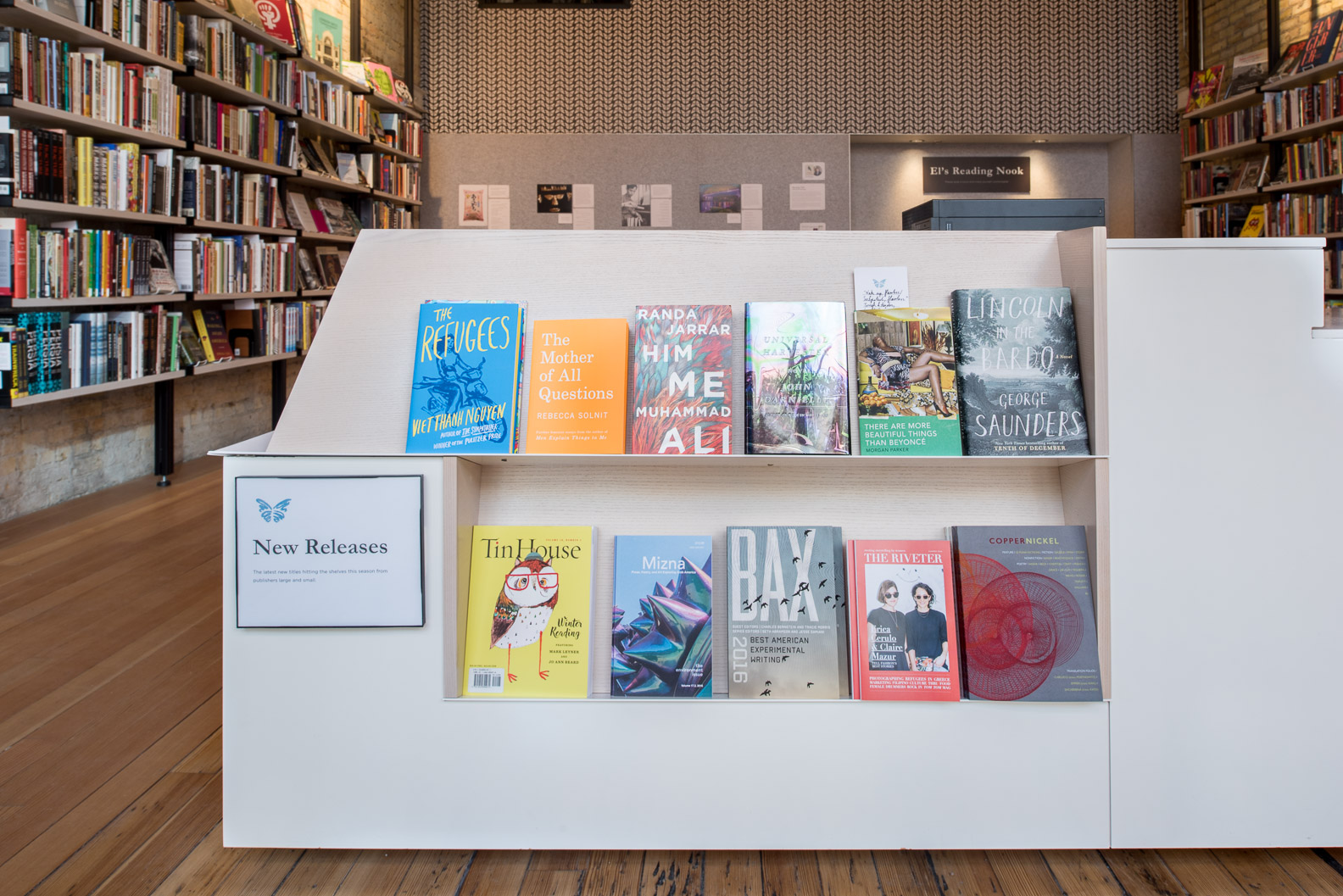 custom checkout counter with built in bookshelves and floating effect