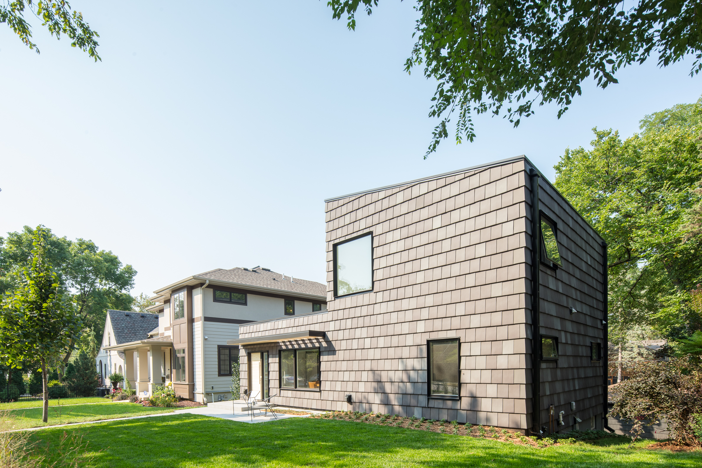 Black clay tile clad modern rambler renovation in Minneapolis by Christian Dean Architecture