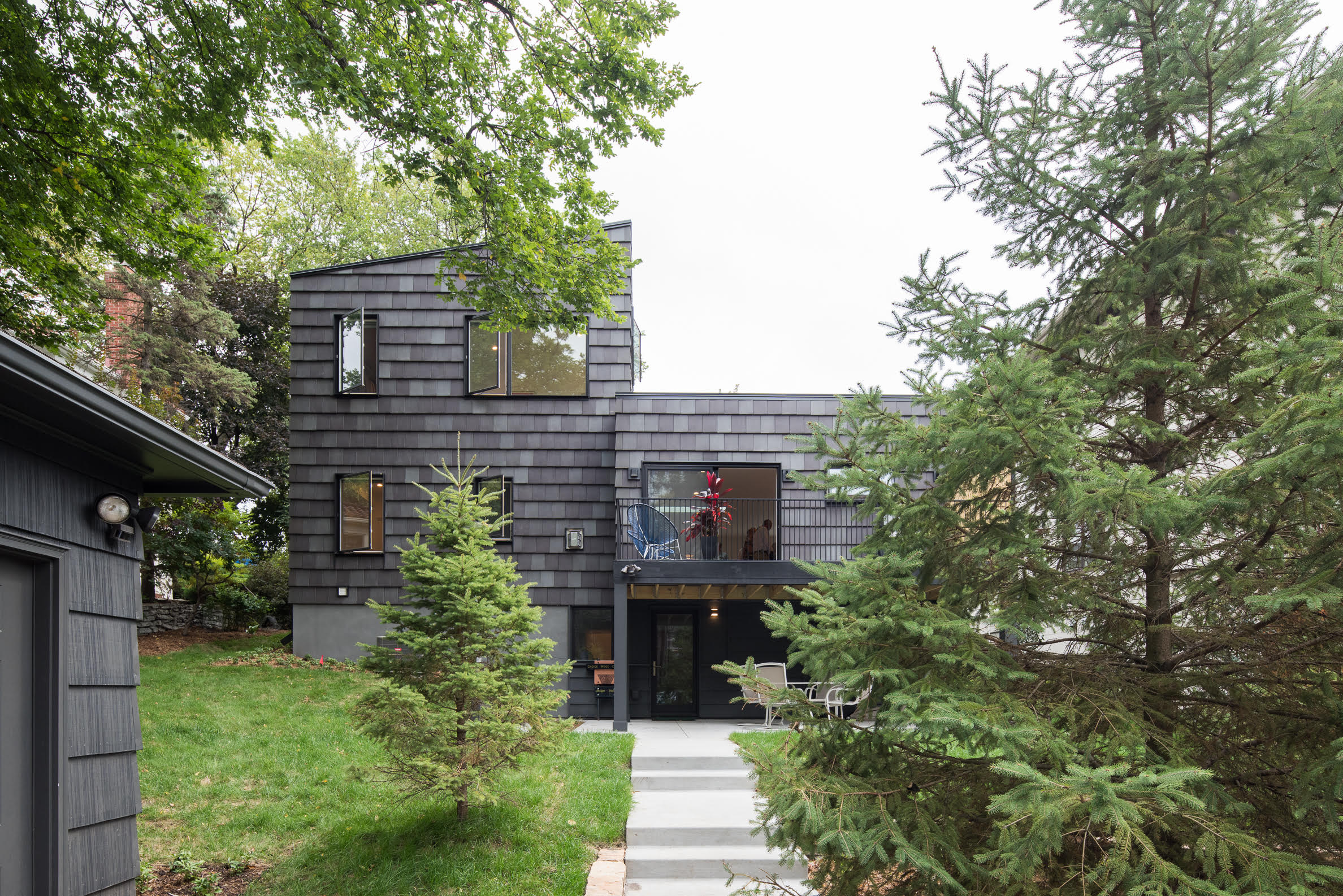 Black clay tile clad modern rambler renovation in Minneapolis by Christian Dean Architecture