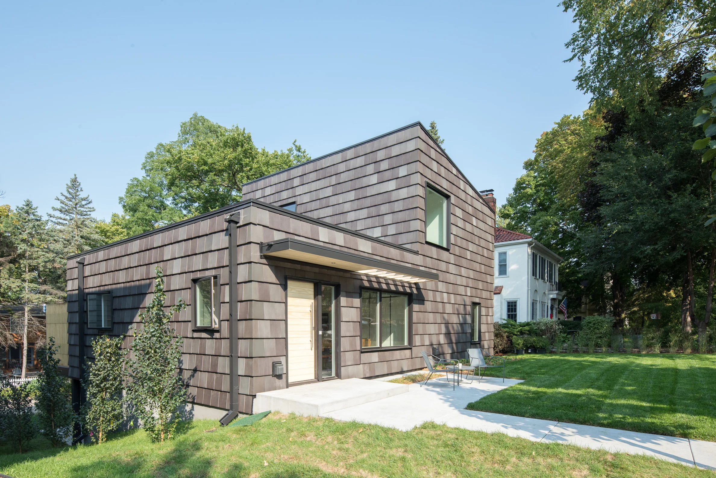 Black clay tile clad modern rambler renovation in Minneapolis by Christian Dean Architecture