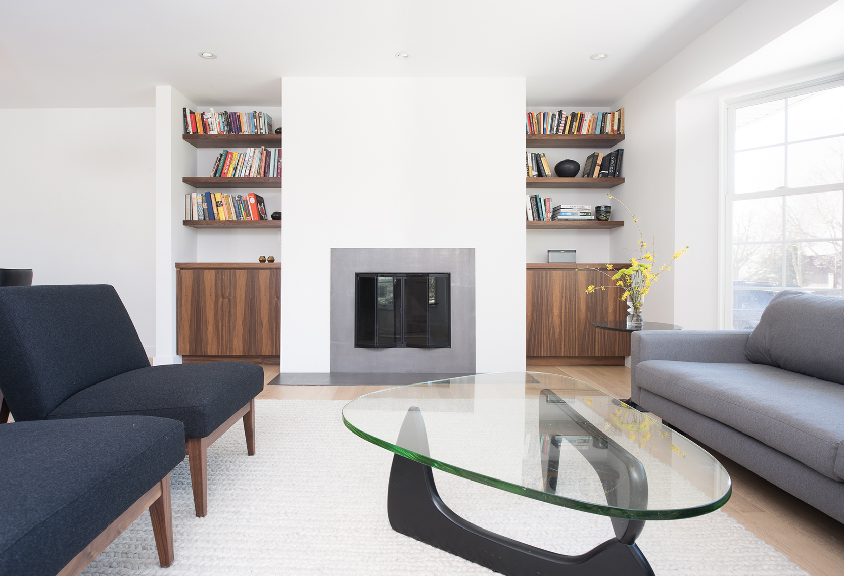 Modern living room fireplace with custom built-in cabinetry