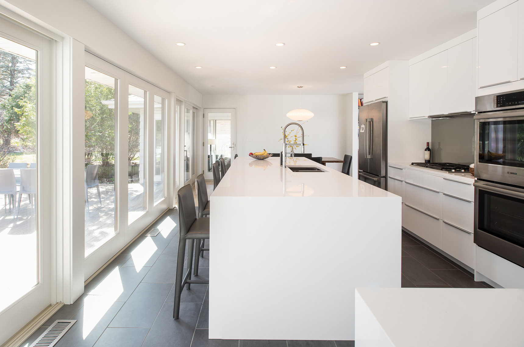 Modern white kitchen renovation in St. Paul, Minnesota by Christian Dean Architecture