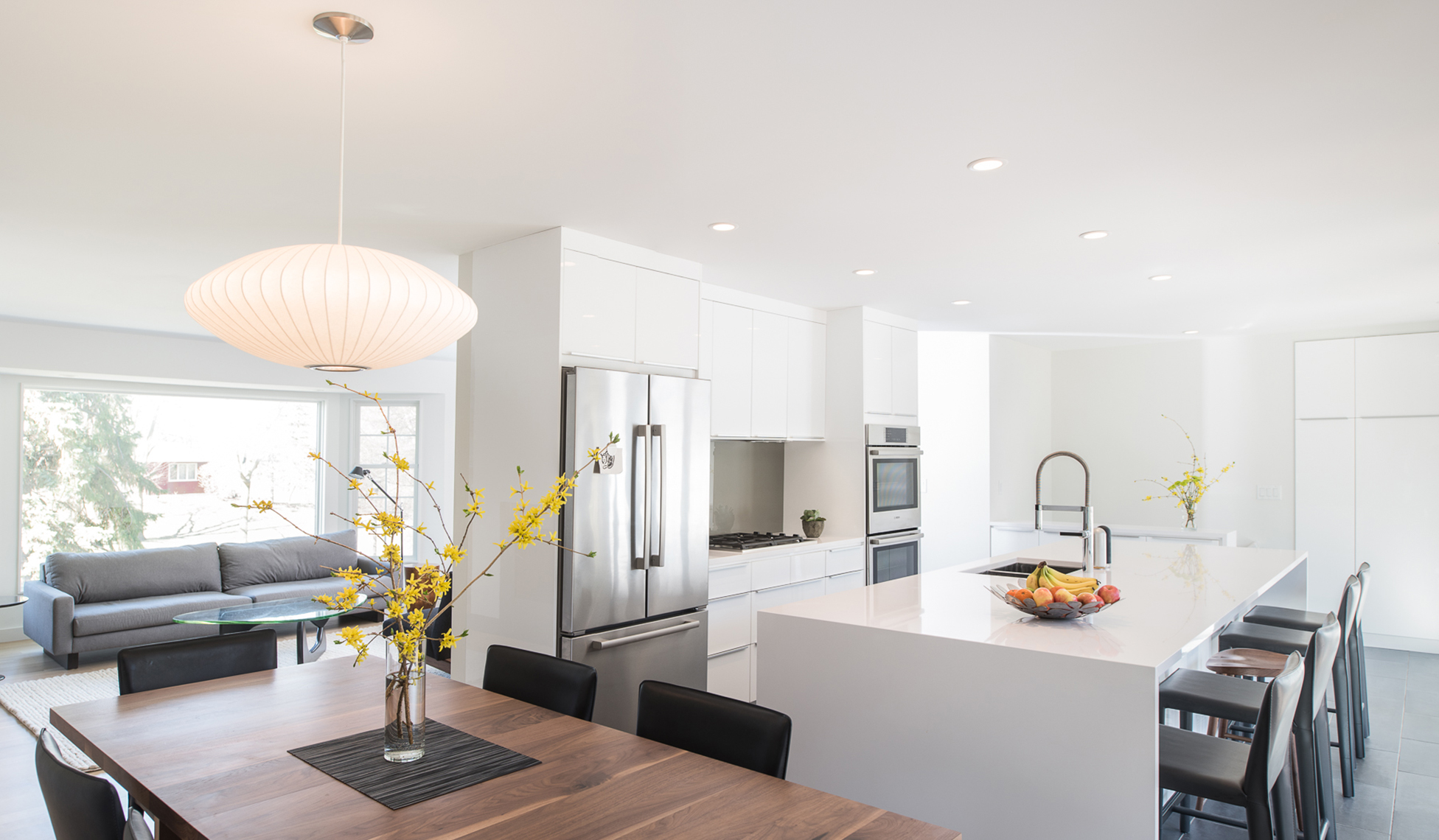 Modern dining area within bright white kitchen
