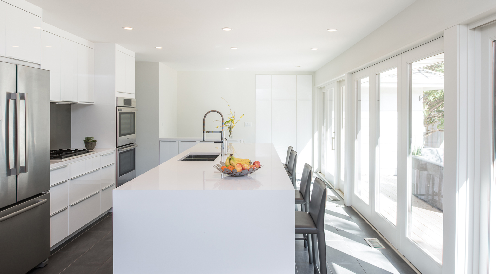 Modern white kitchen renovation in St. Paul, Minnesota by Christian Dean Architecture