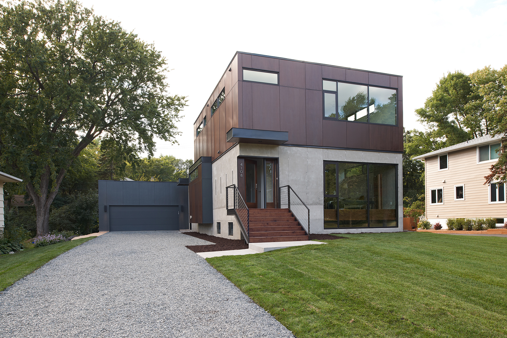 Modern home with concrete and corten steel exterior in Minneapolis by Christian Dean Architecture
