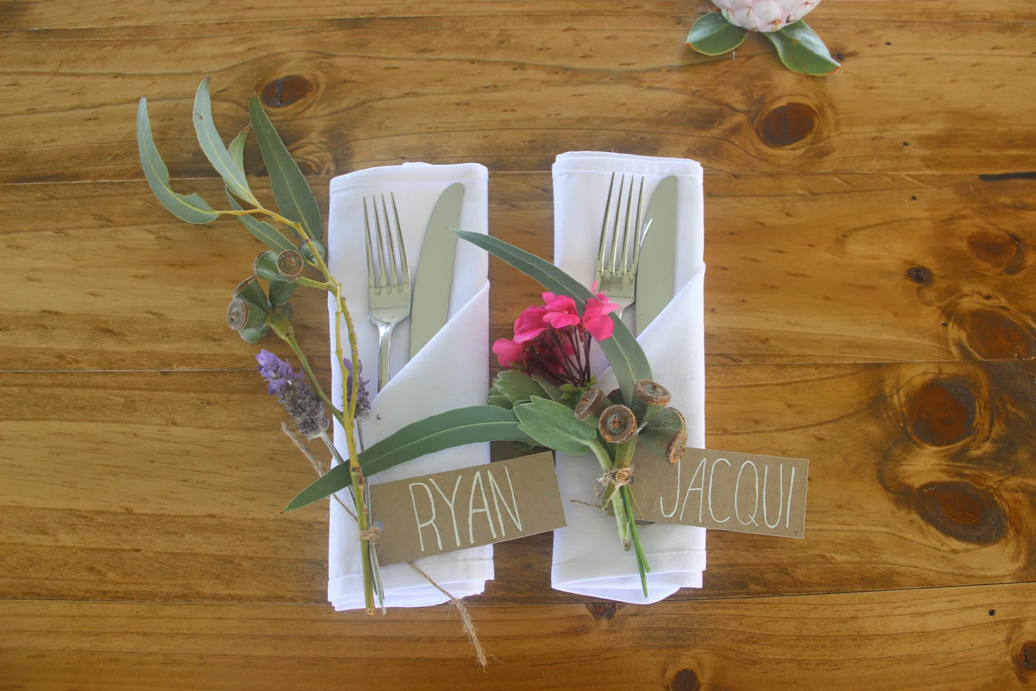  Native flora was tied to the handwritten guest name tags. 