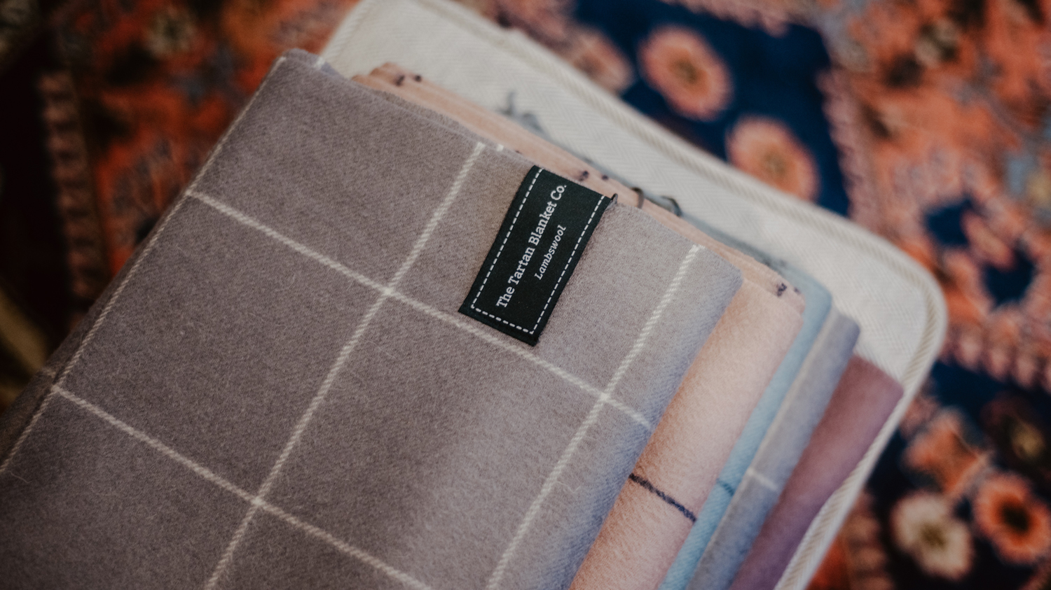 The labels were designed to wrap around the front and back of the blankets and scarves. The unique label design stood out from competitors labelling styles as well as allowing the blankets and scarves to be hung on coat racks.