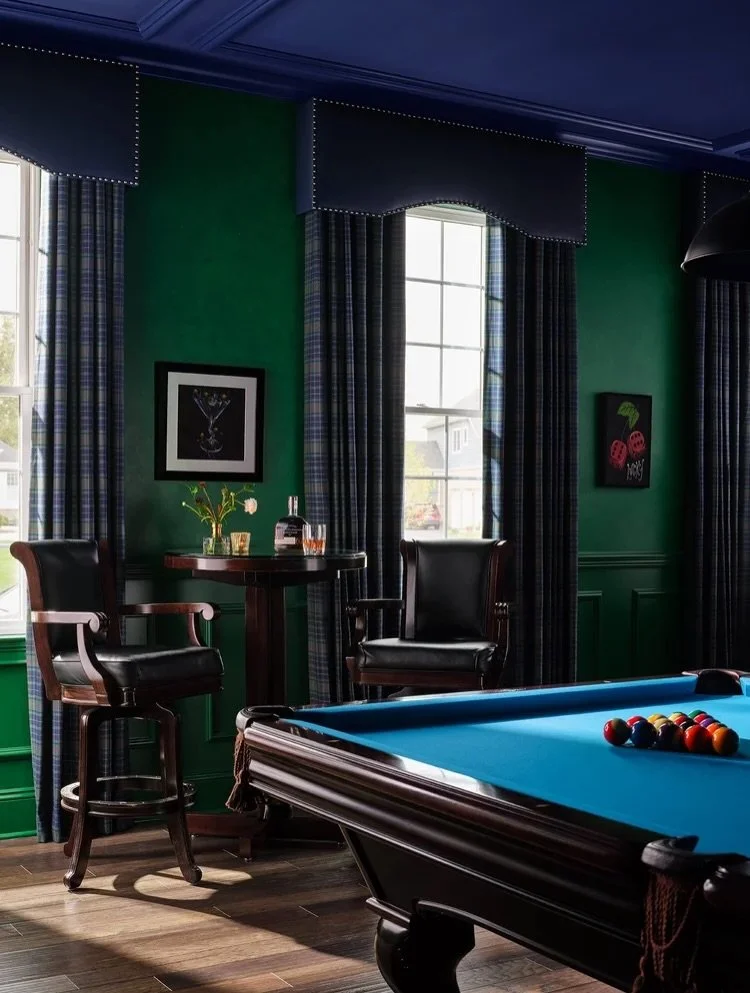 Tailored plaid drapery with classic cornices, a punchy blue pool table, and cocktails in hand and suddenly this lounge is the most fun room in the house.
Who&rsquo;s breaking first? 🎱

📸 @dustinforest