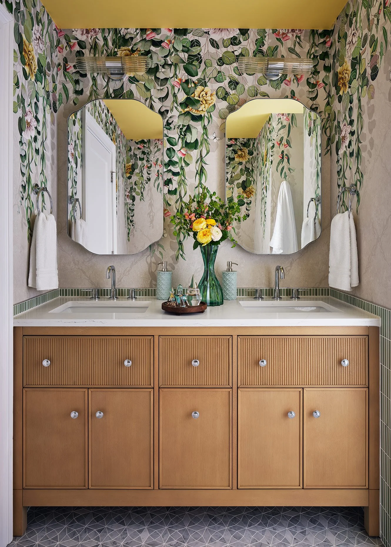 Custom bathroom design featuring decorative tile, custom millwork, designer fixtures, and colorful interior design by Sarah Jacquelyn Interiors.