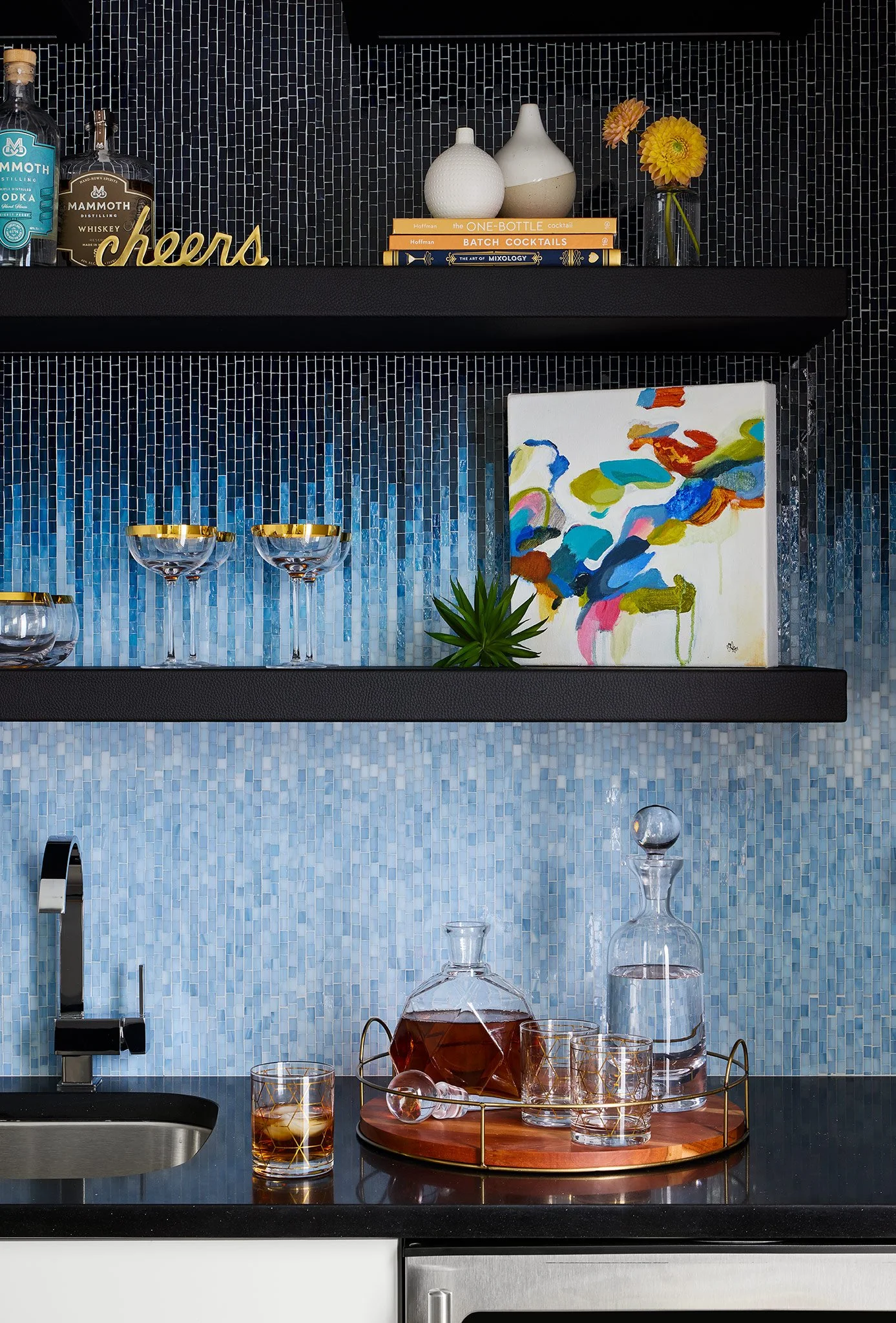 Luxury custom bar with rich cabinetry, designer lighting, decorative tile, and layered finishes in a Chicago home renovation.