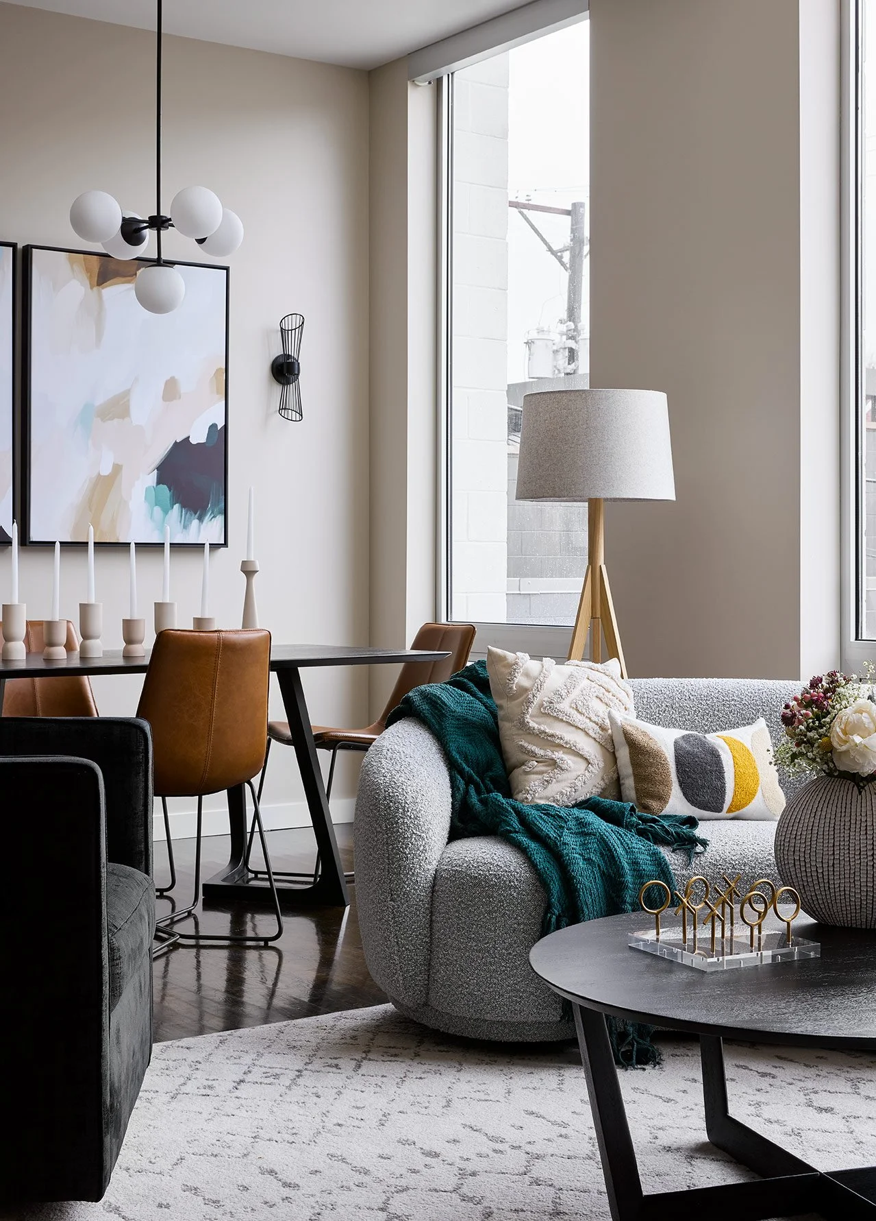 Chicago condo interior featuring custom lighting, designer furnishings, and colorful decor. / Luxury Chicago brownstone living room with custom furnishings, layered textures, and restored historic details.