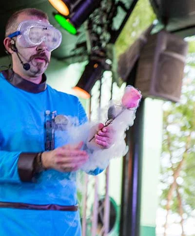 Hagerman dipping a rose into liquid nitrogen