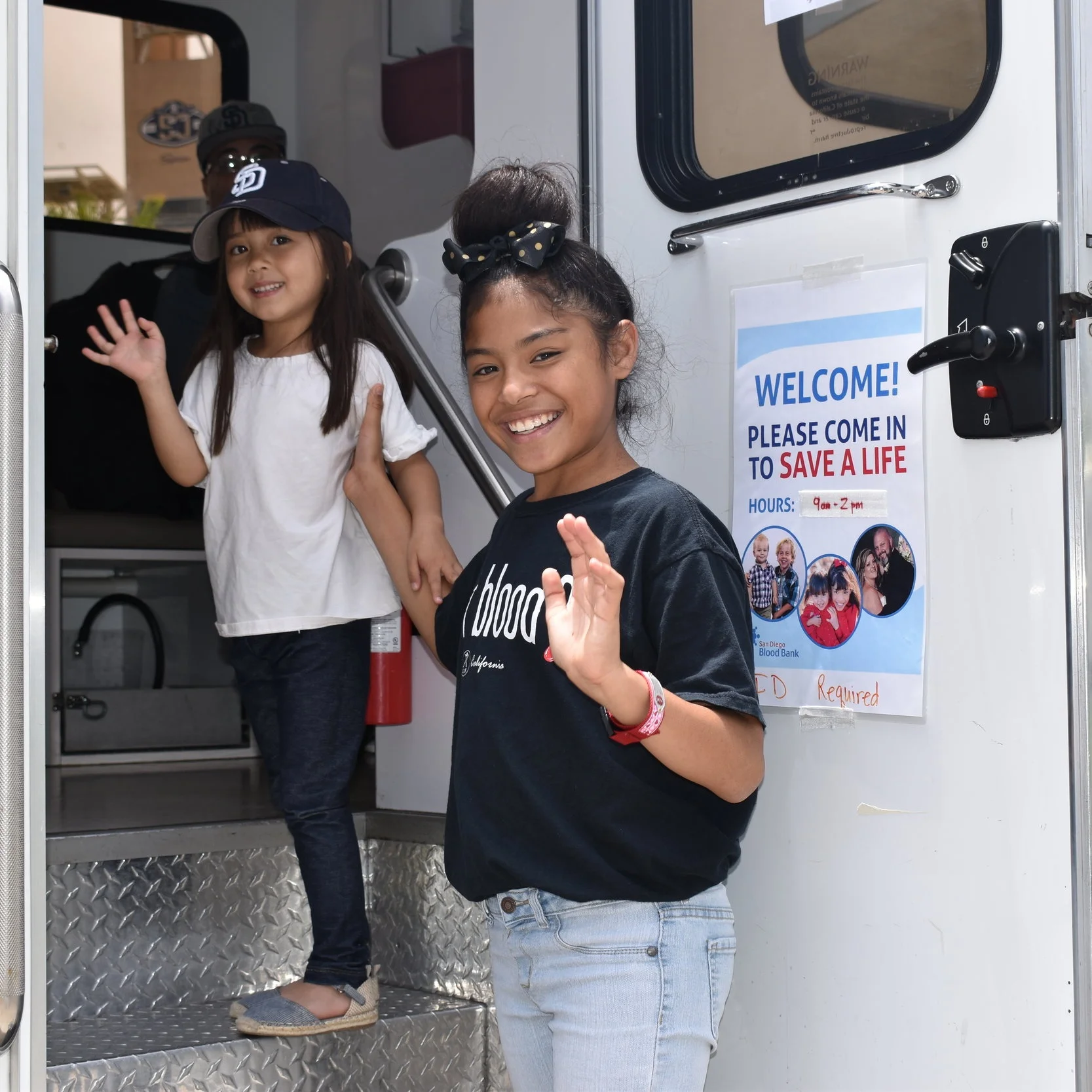 Kamila and Ella board a Bloodmobile full of smiles and gratitude.